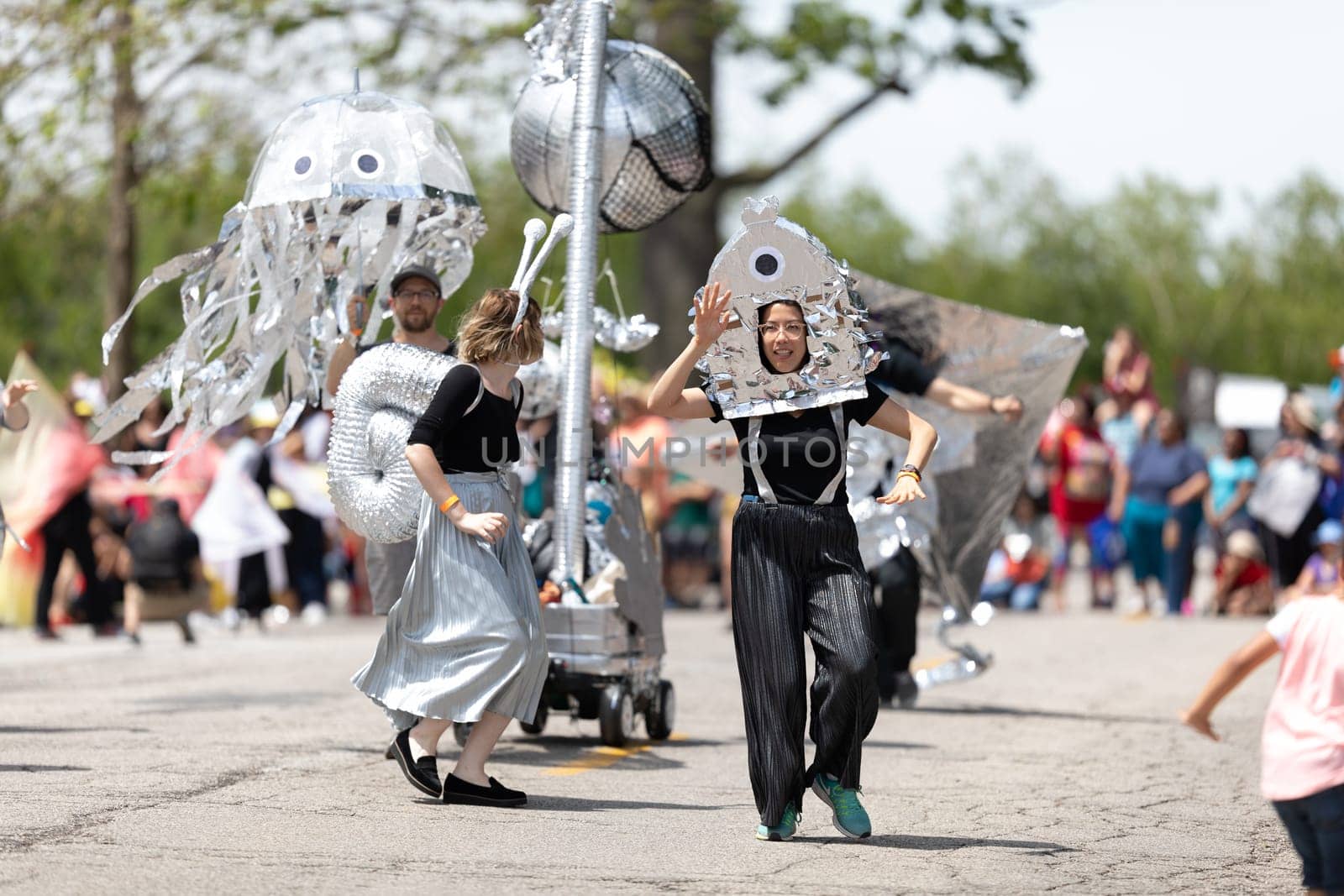 Cleveland, Ohio, USA - June 8, 2019: Parade the Circle, young woman wearing an abstract outfit dancing