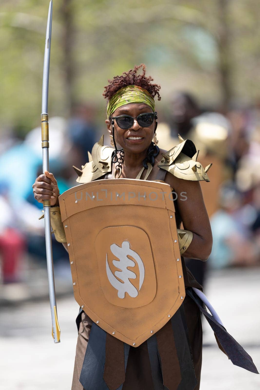 Cleveland, Ohio, USA - June 8, 2019: Parade the Circle, African American woman dress up as a warrior from the movie black panthers during the parade