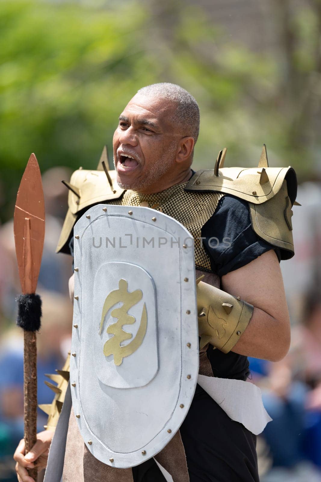 Cleveland, Ohio, USA - June 8, 2019: Parade the Circle, African american man dress up as a warrior from the movie black panther