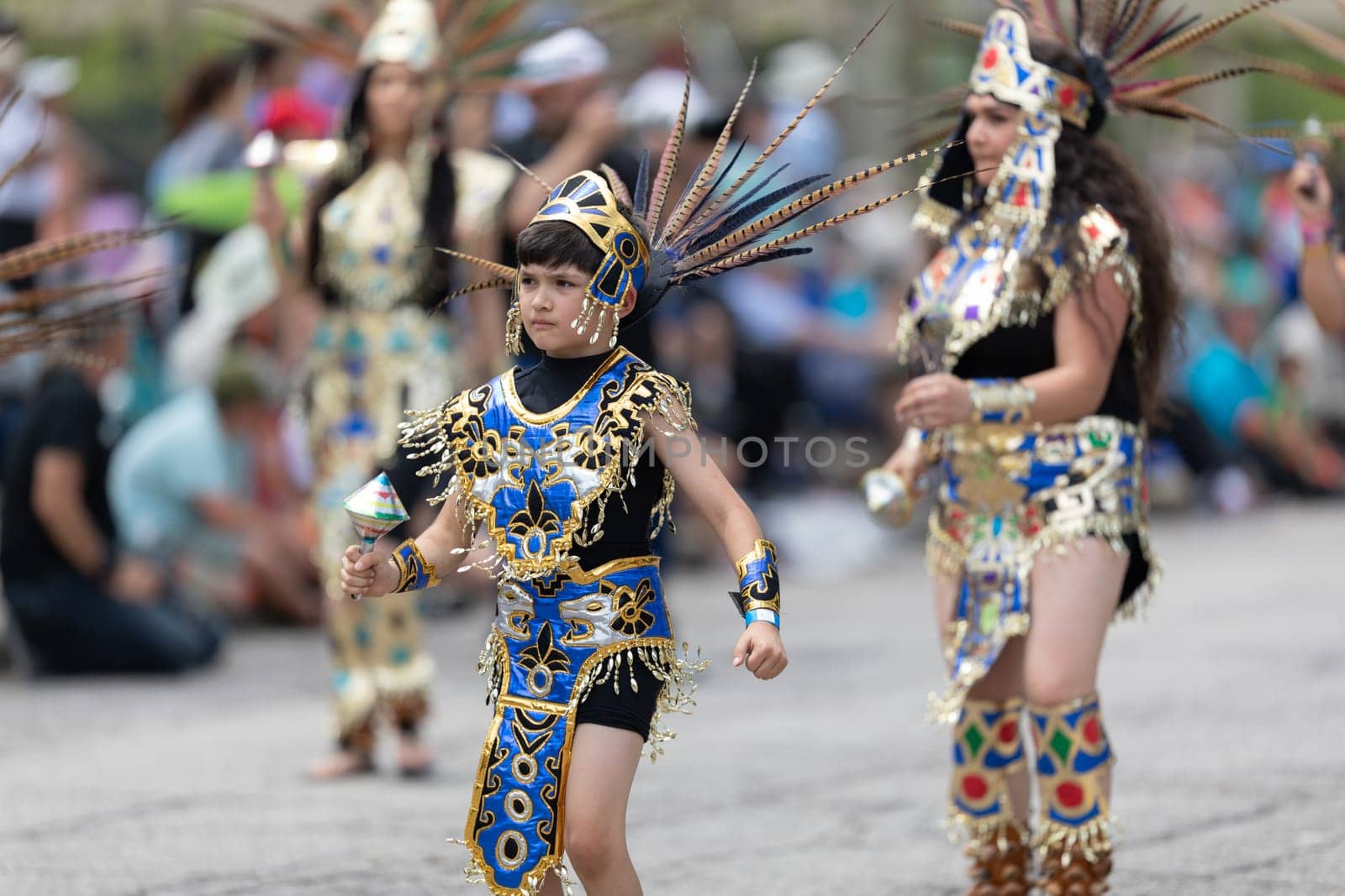 Cleveland, Ohio, USA - June 8, 2019: Parade the Circle, woman and children using aztek outfits dancing.