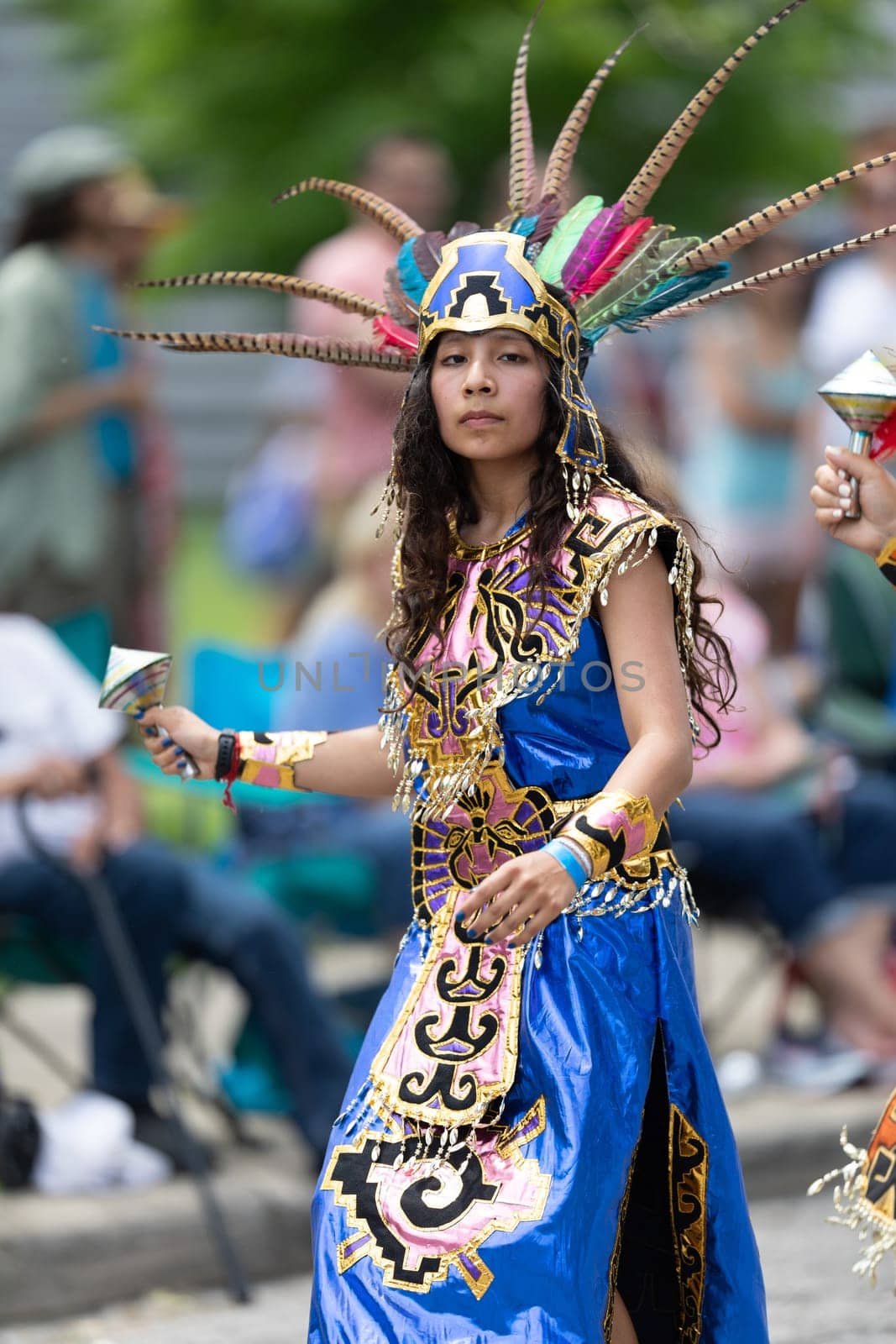Cleveland, Ohio, USA - June 8, 2019: Parade the Circle, woman and children using aztek outfits dancing.