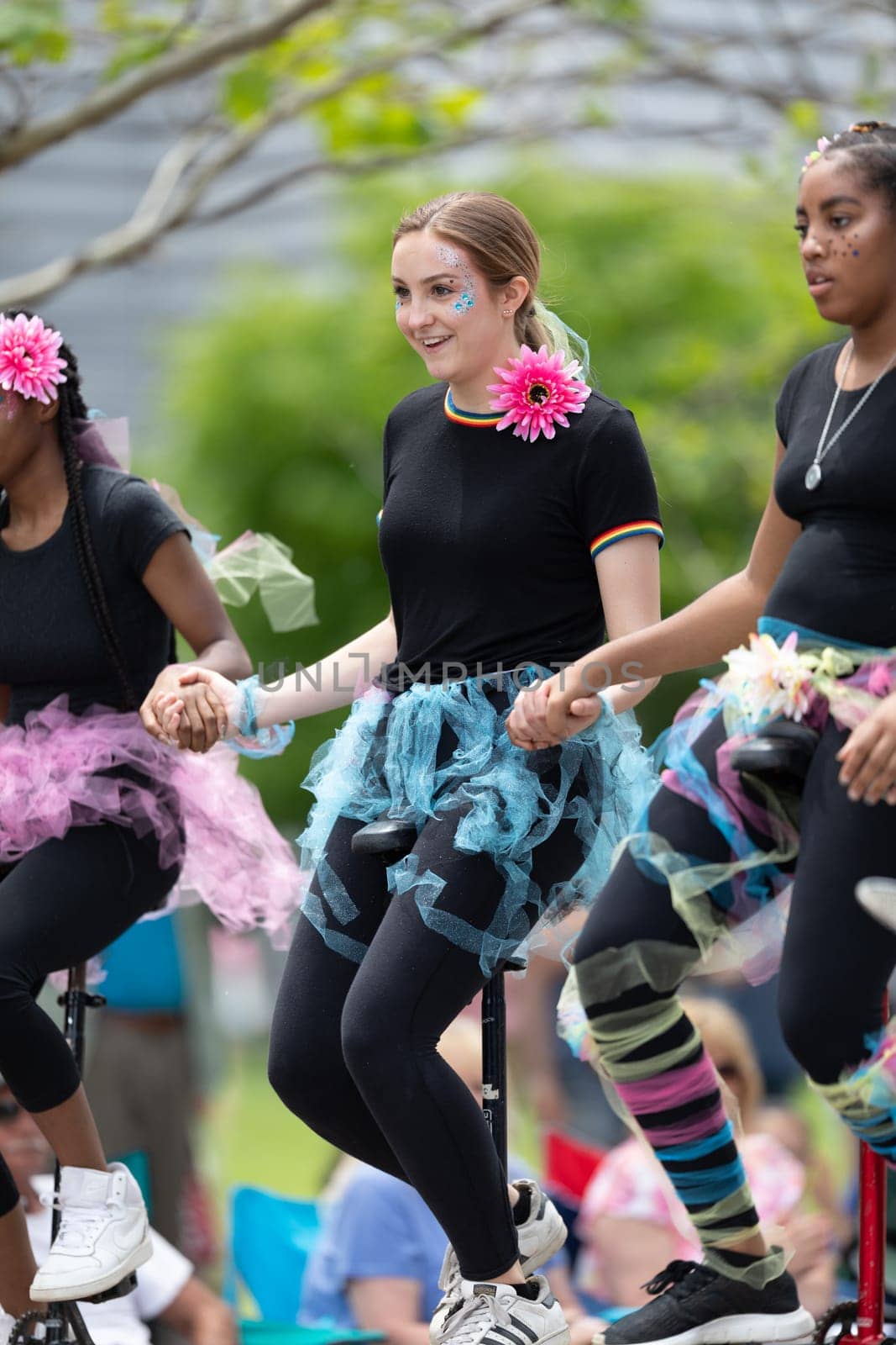 Cleveland, Ohio, USA - June 8, 2019: Parade the Circle, young women riding unicycles