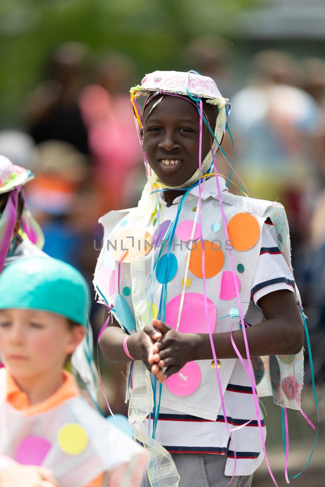 Cleveland, Ohio, USA - June 8, 2019: Parade the Circle, african american boy wearing a hat with ribbons during the parade