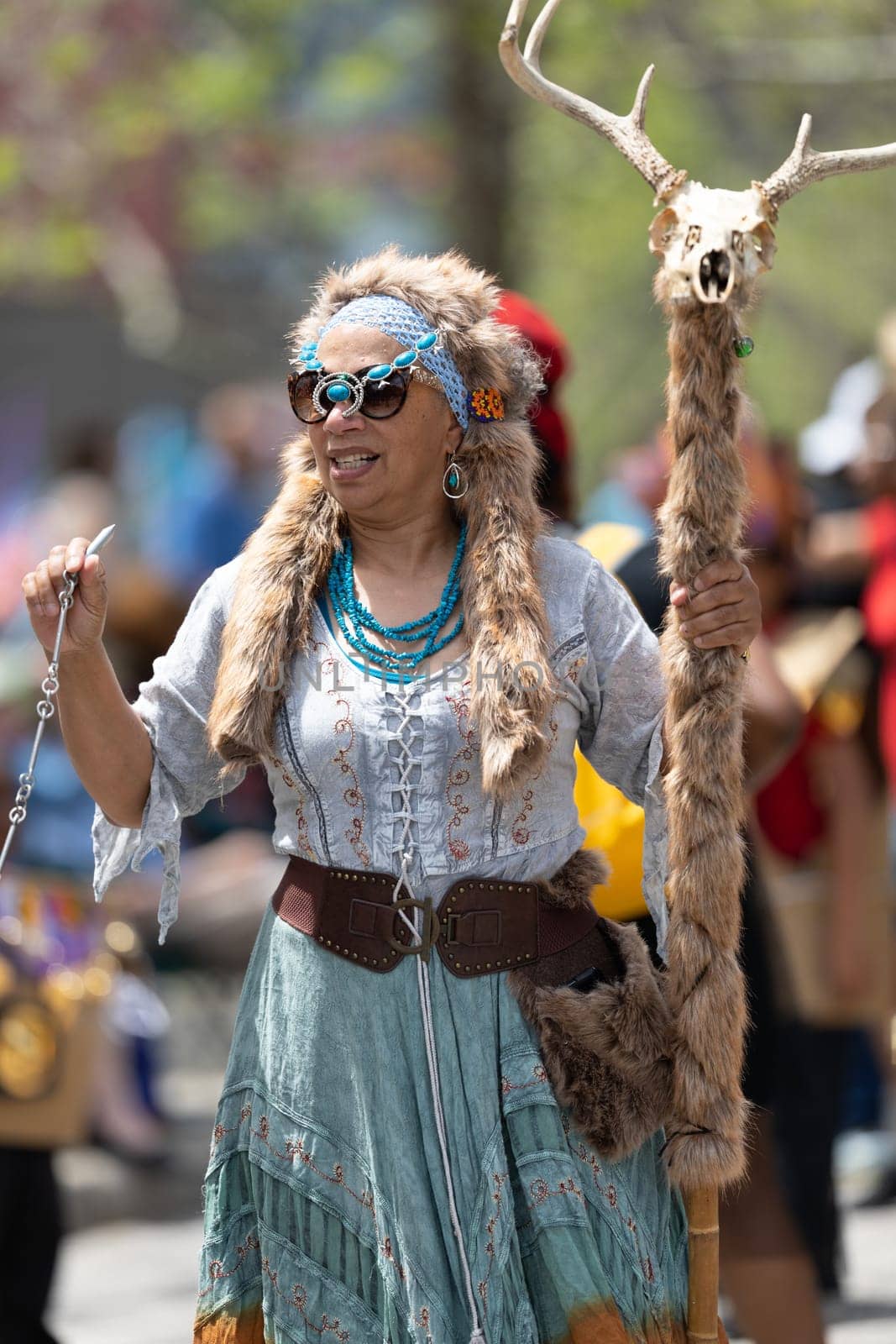 Cleveland, Ohio, USA - June 8, 2019: Parade the Circle, african  american woman wearing traditional clothing holding a batton