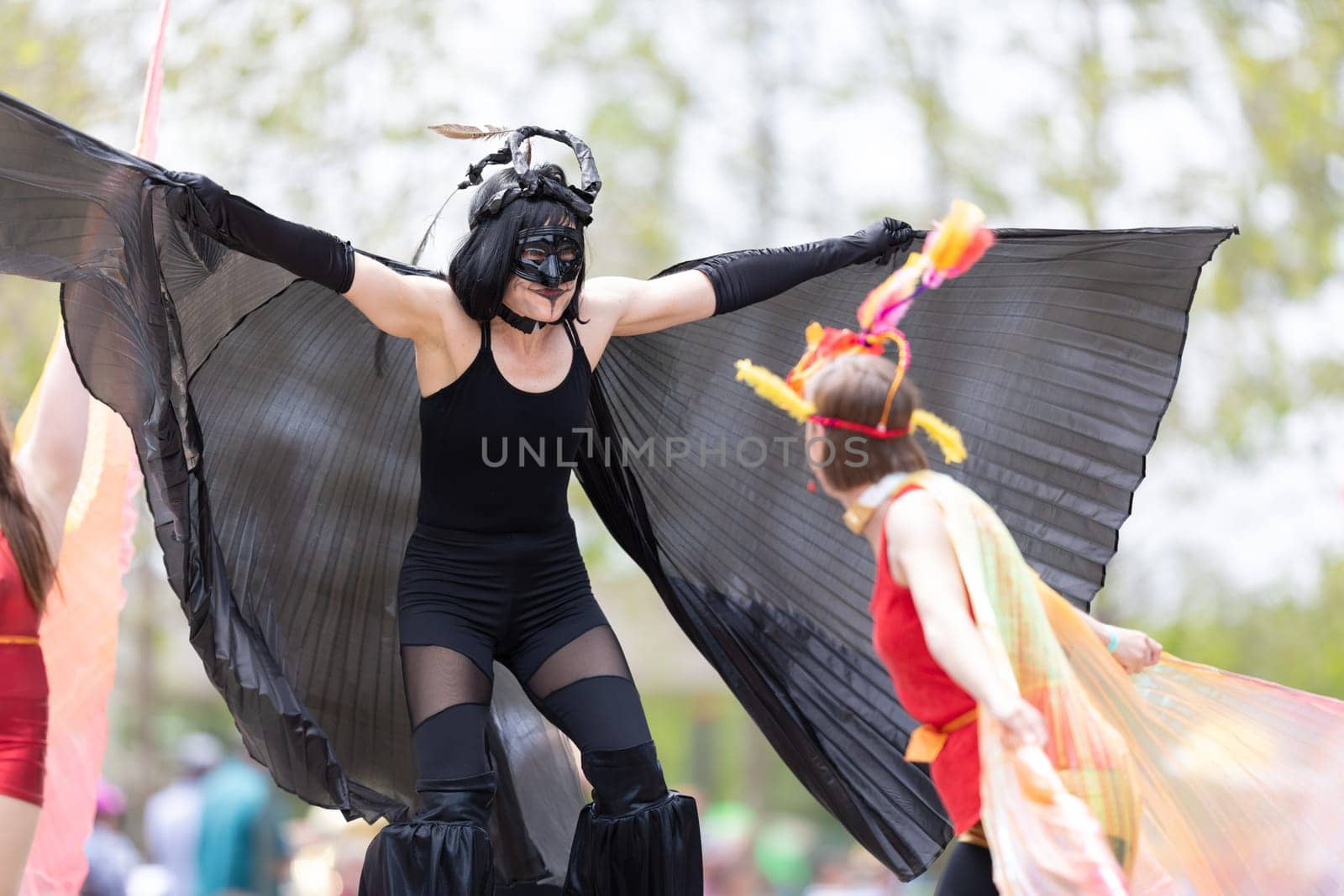 Cleveland, Ohio, USA - June 8, 2019: Parade the Circle, women on stilts with outfits with wings at the parade