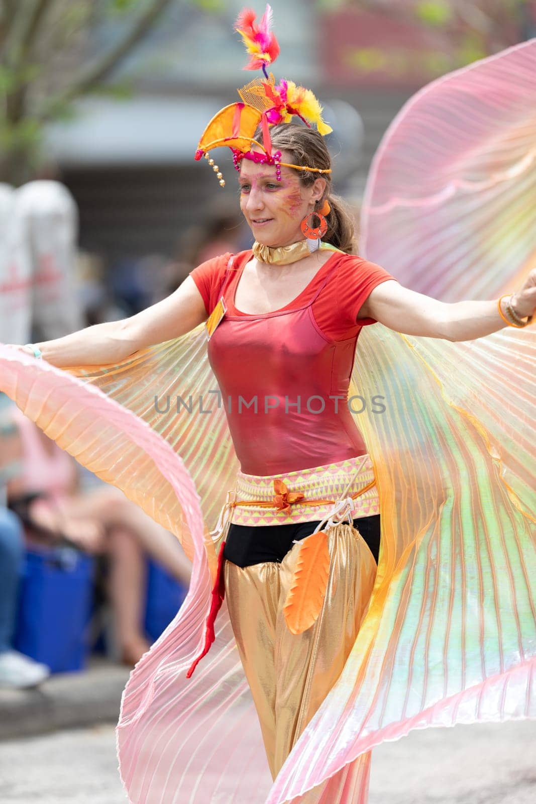 Cleveland, Ohio, USA - June 8, 2019: Parade the Circle, women on stilts with outfits with wings at the parade