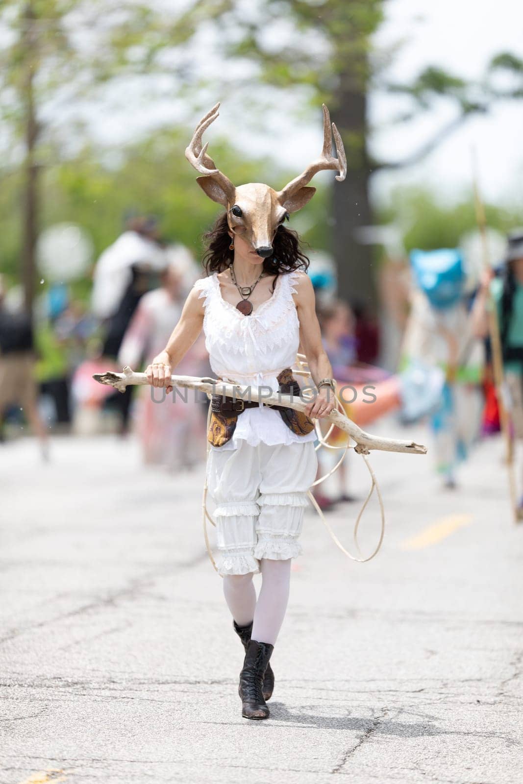 Cleveland, Ohio, USA - June 8, 2019: Parade the Circle, woman wearing a deer face mask