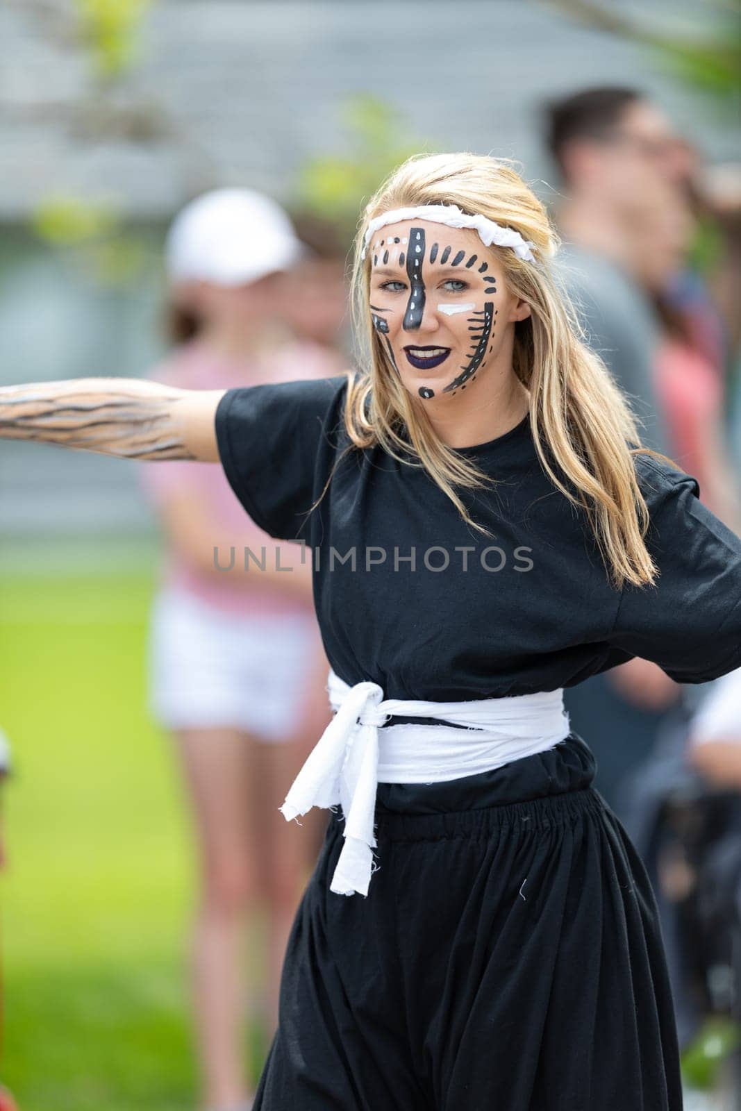 Cleveland, Ohio, USA - June 8, 2019: Parade the Circle, woman with face paint, dancing