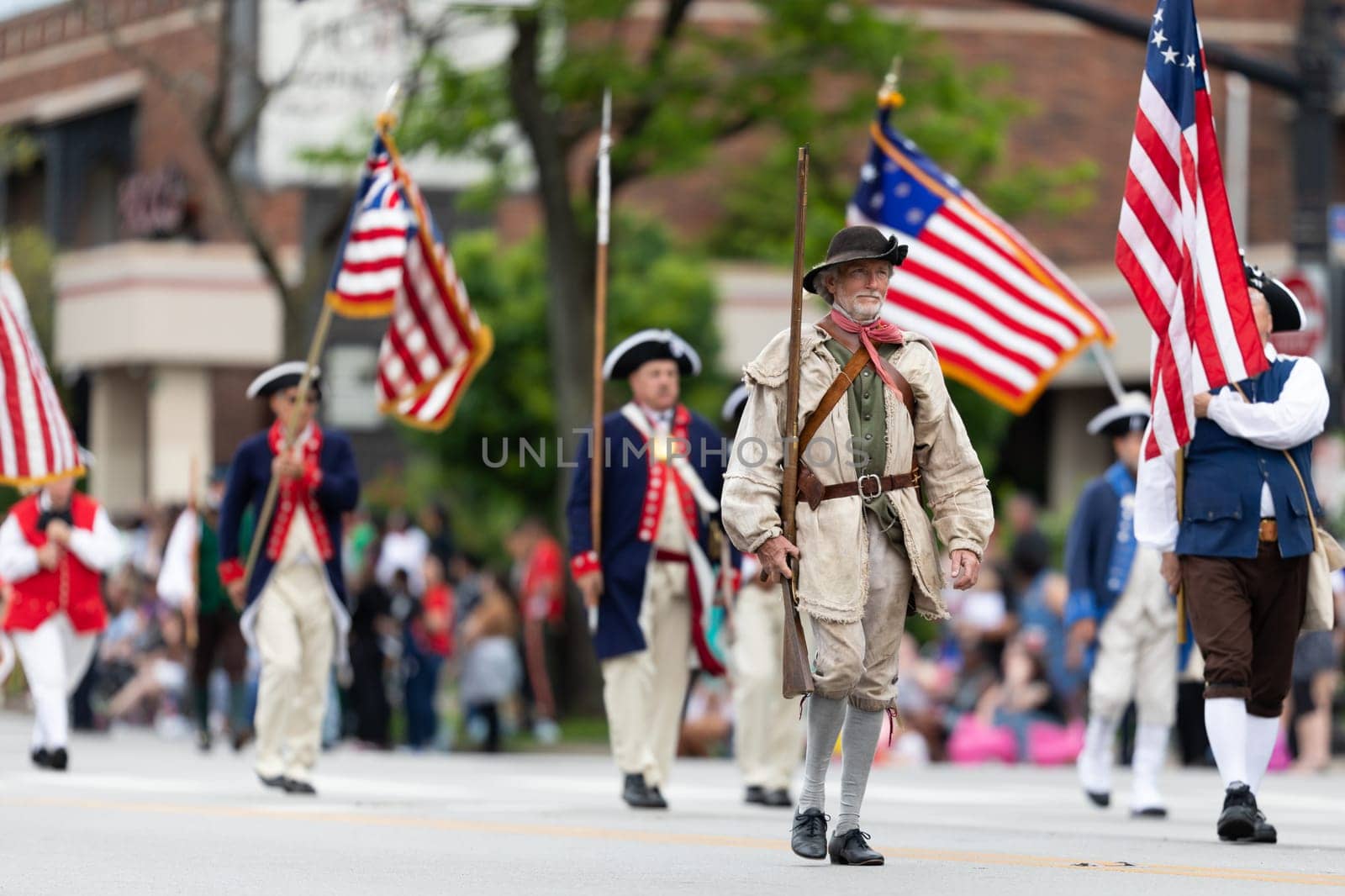 Louisville, Kentucky, USA - May 2, 2019: The Pegasus Parade, Members of the Sons of the American Revolution, wearing traditional clothing marching down the street during the parade