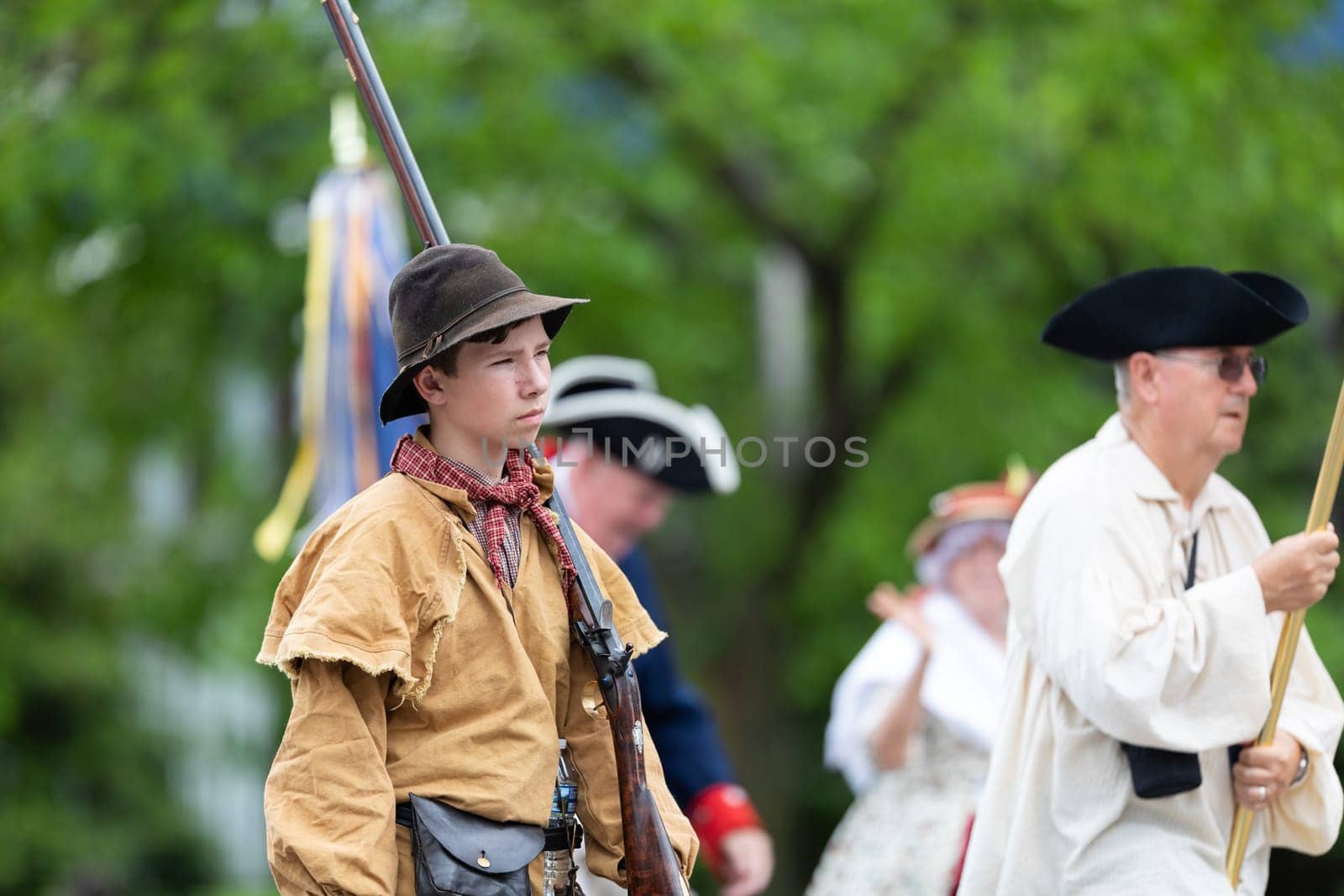 Louisville, Kentucky, USA - May 2, 2019: The Pegasus Parade, Members of the Sons of the American Revolution, wearing traditional clothing marching down the street during the parade