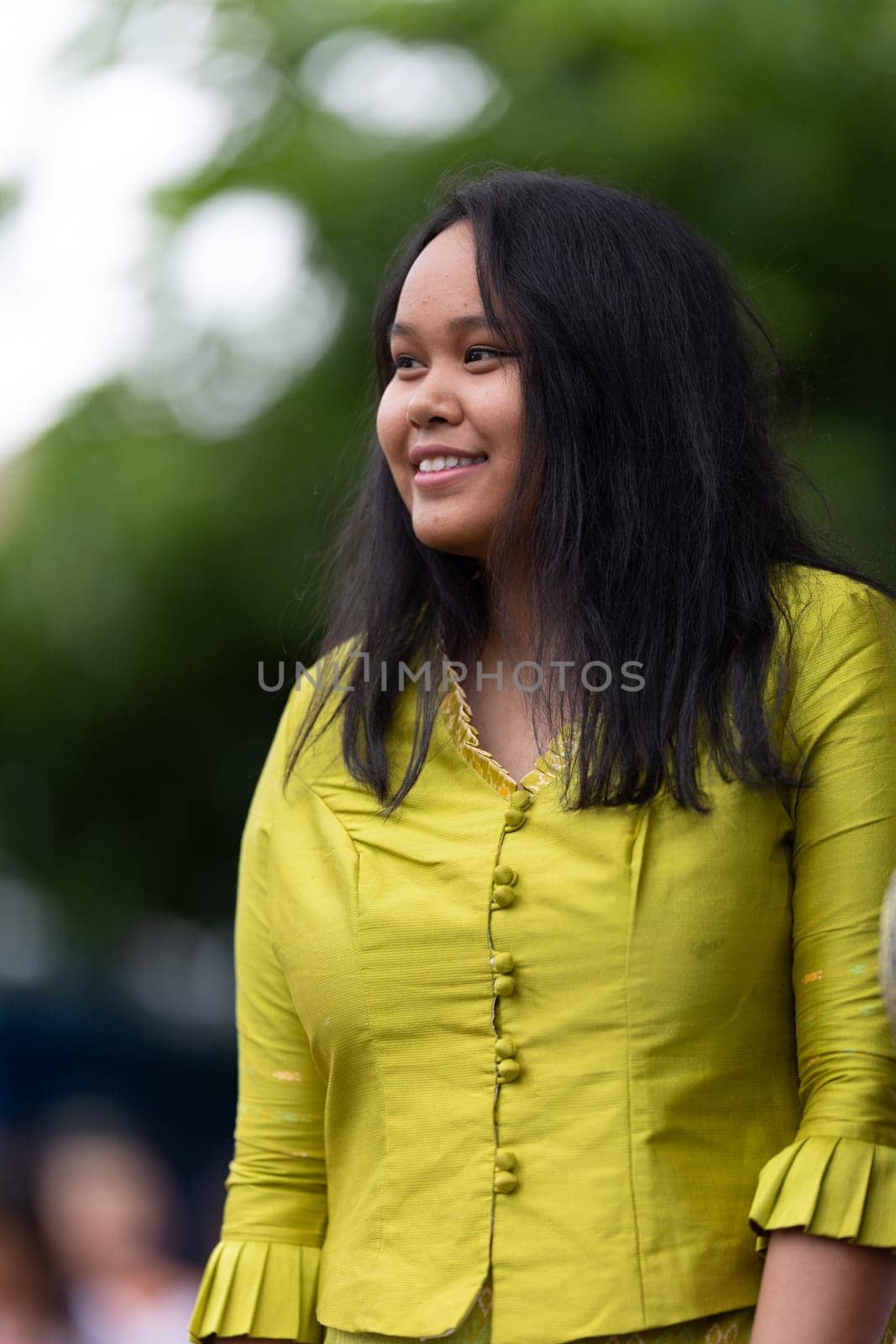Grand Rapids, Michigan, USA - June 15, 2019: Asian Pacific Festival, cambodian woman wearing traditional clothing at a fashion display  in the Rosa Parks Circle
