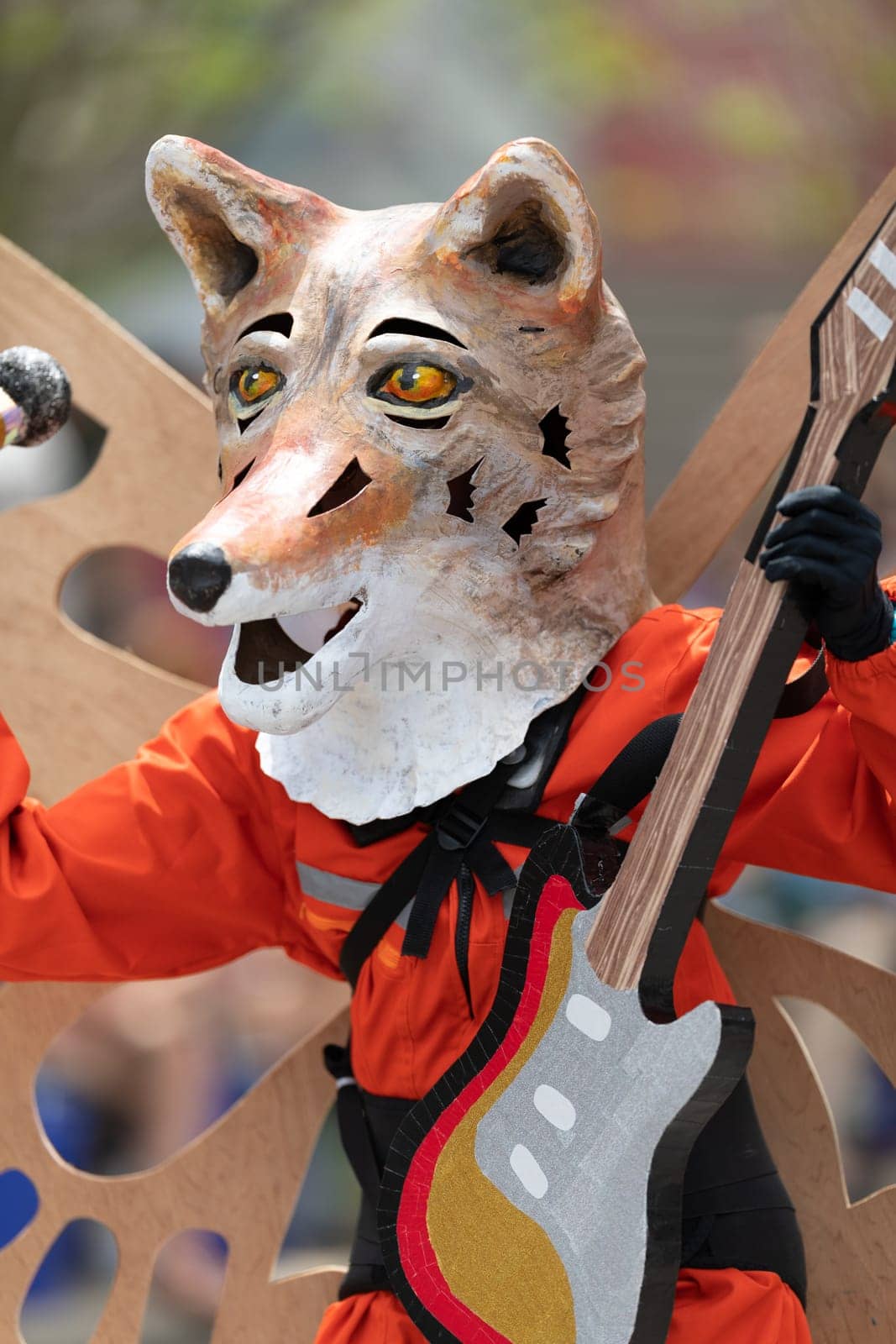 Cleveland, Ohio, USA - June 8, 2019: Parade the Circle, person dress up as a fox with butterflie wings and playing a guitar