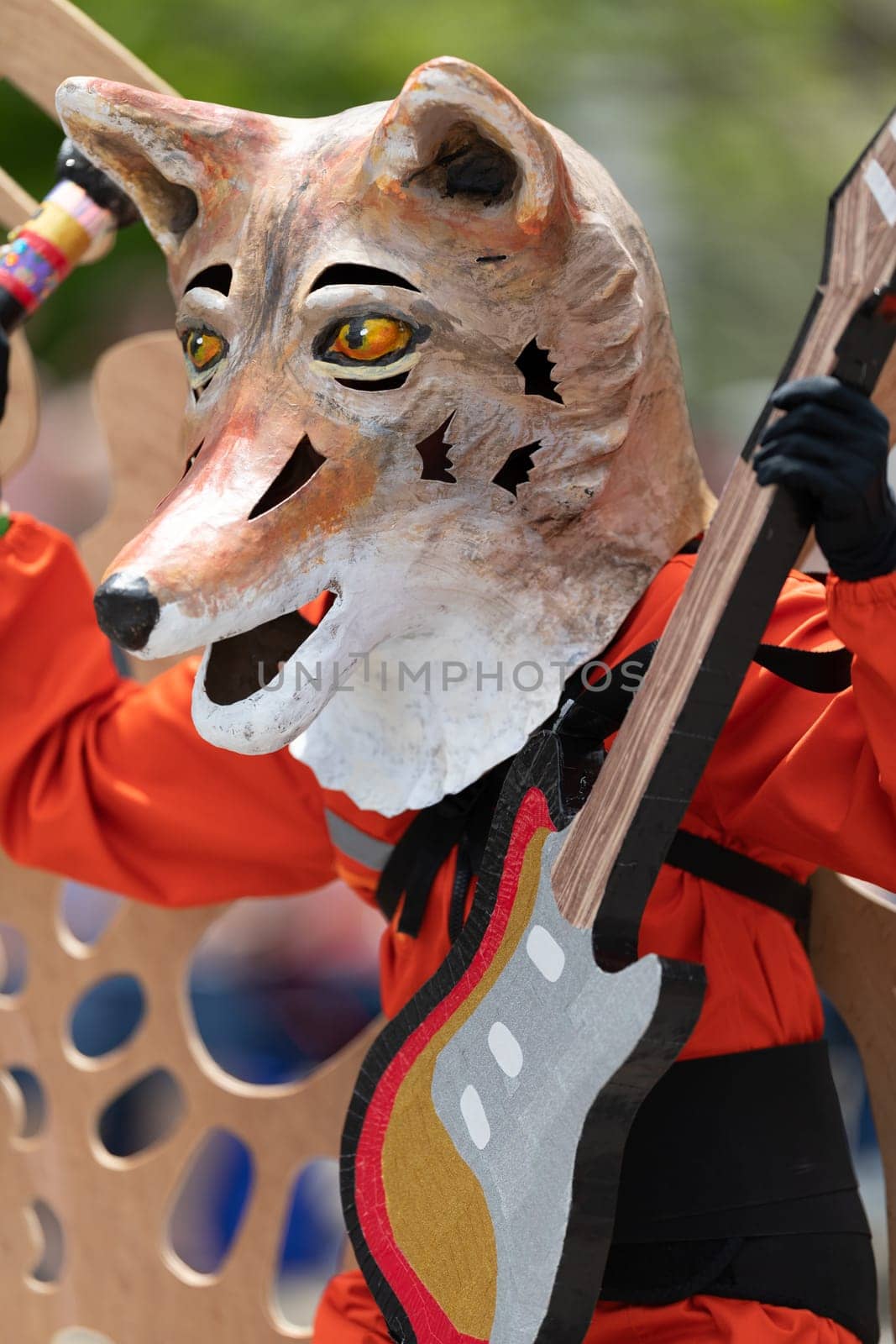 Cleveland, Ohio, USA - June 8, 2019: Parade the Circle, person dress up as a fox with butterflie wings and playing a guitar