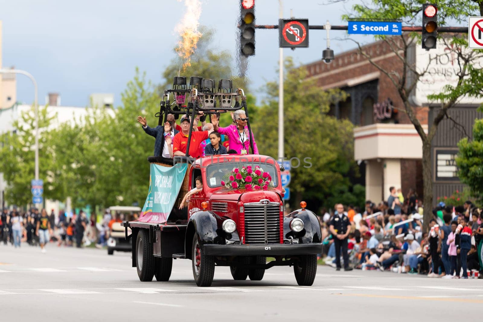 Louisville, Kentucky, USA - May 2, 2019: The Pegasus Parade, Classic Turck carrying two hot air balloon baskets, shooting flames during the parade