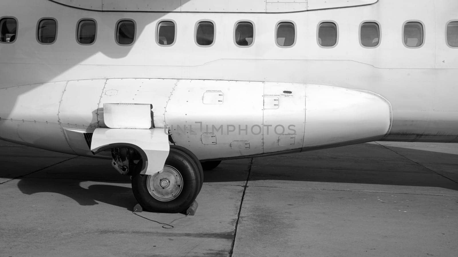 airplane side exterior fuselage windows wheels black white