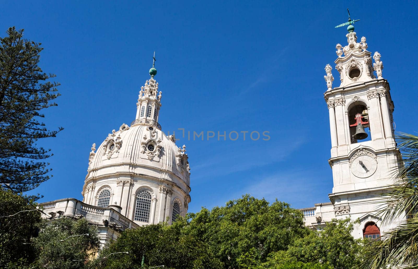 Dome and clock tower of the late Baroque and Neo-Classical Royal Basilica and Convent of the Most Sacred Heart of Jesus, built in late 18th century in Lisbon, Portugal