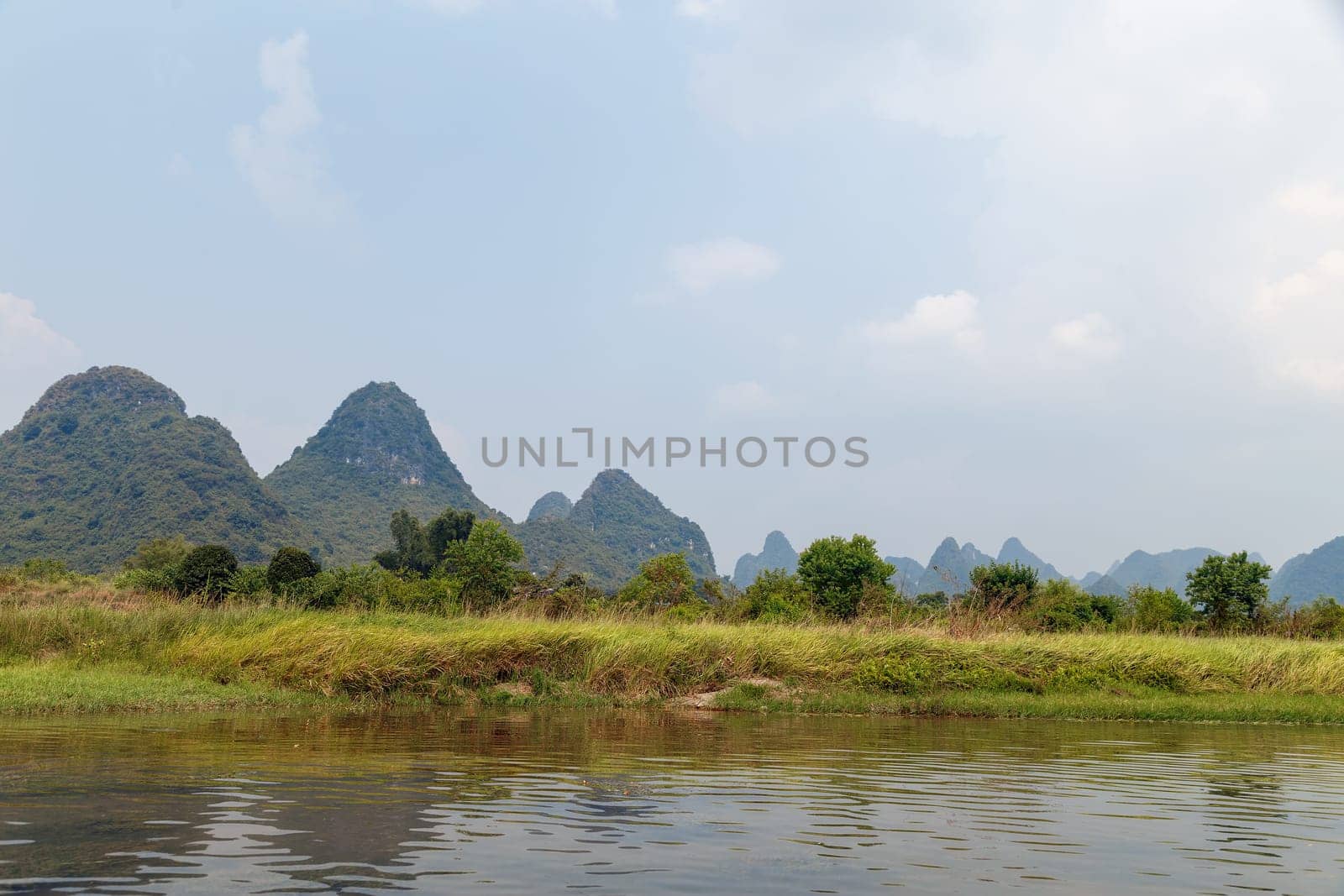 View of the picturesque mountains from the river, Yangshuo, China, Asia