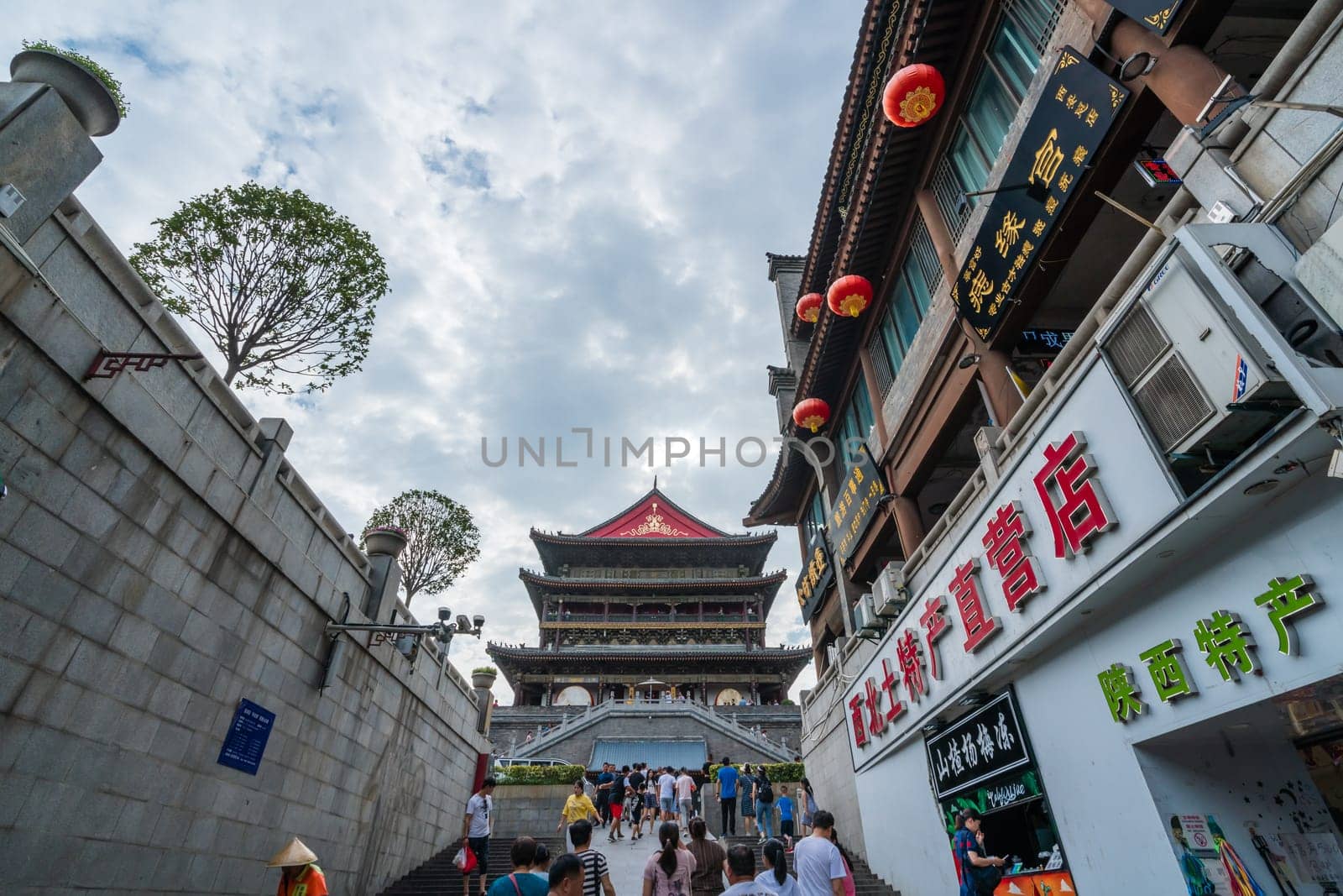 Xian, China -  July 2019 : People climbing up the stairs leading to the landmark Drum Tower in the city Xian, Shaaxi Province