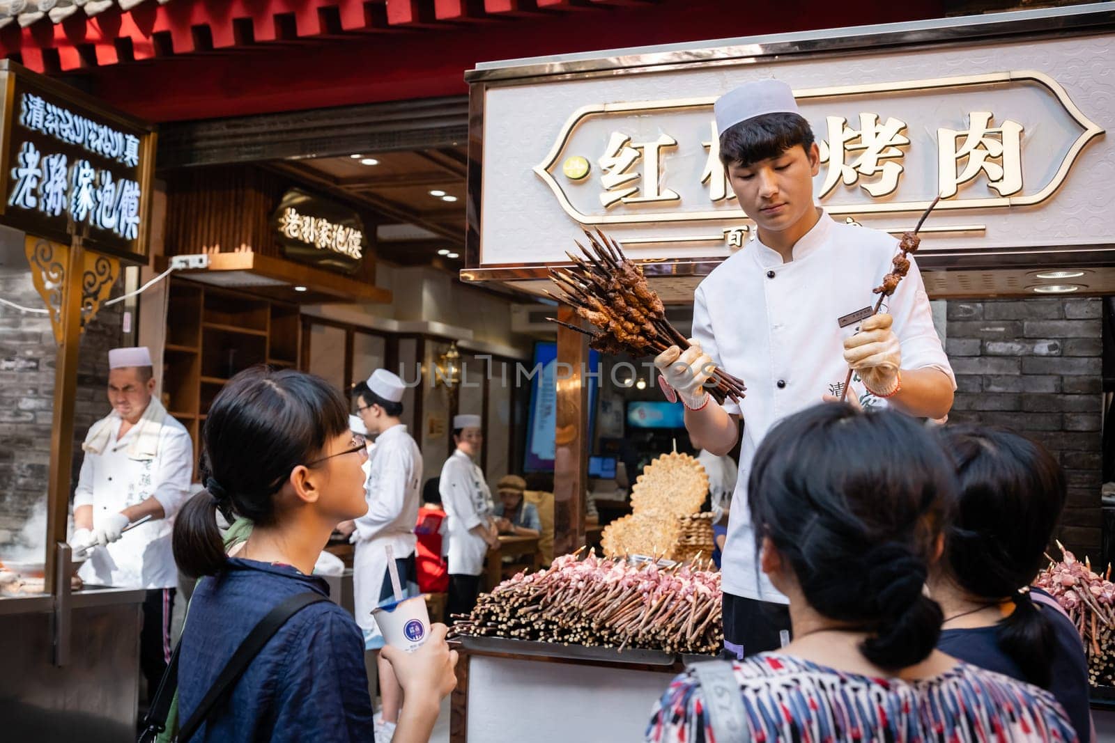 Xian, China -  July 2019 : Meat, snacks, kabap vendor selling food on the street in the Muslim Quarter