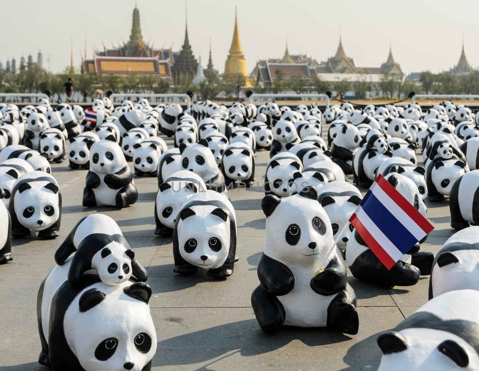 BANGKOK, THAILAND - MARCH 4, 2016: Exhibition of the 1,600 paper-mache panda sculptures world tour collaboration between WWF and French artist Paulo Grangeon at Sanam Luang in Bangkok, Thailand.