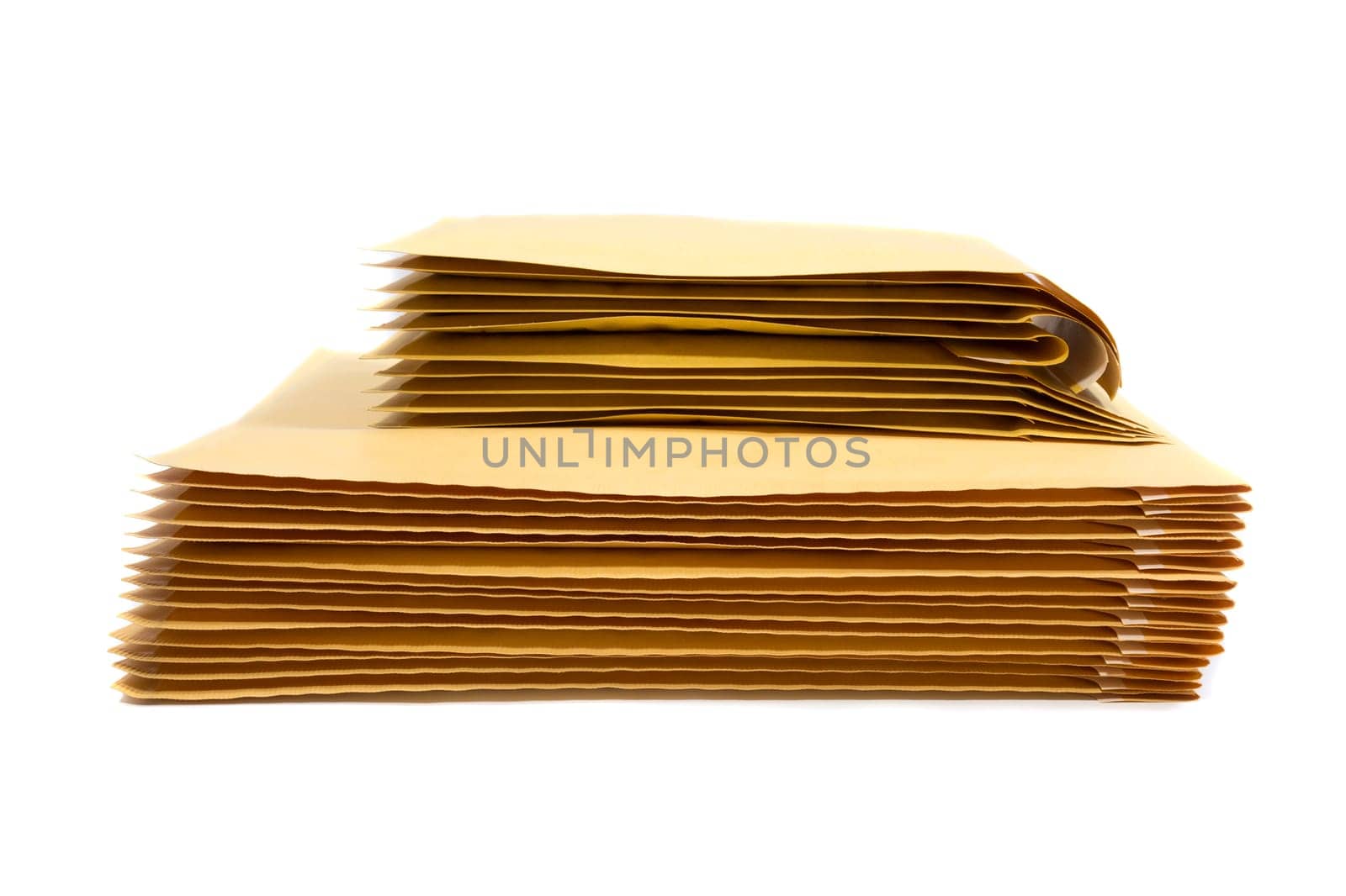 Stack of padded mailing envelopes isolated against a white background