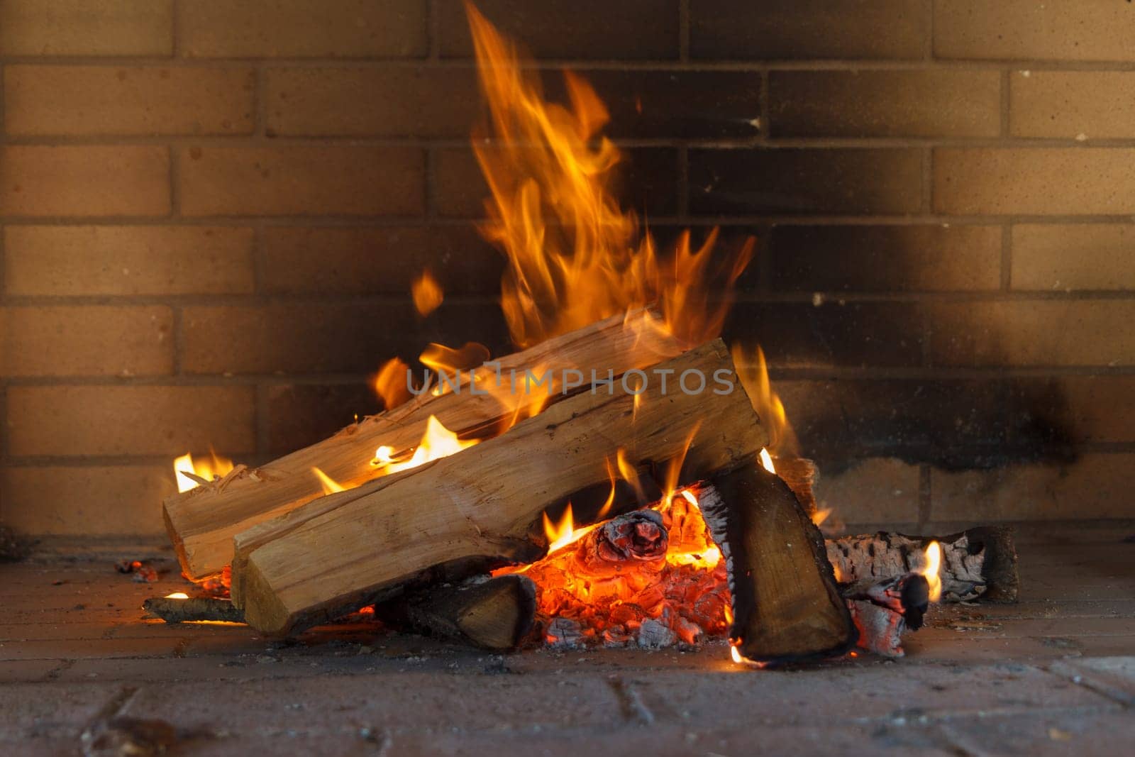 Close up shot of burning firewood in the fireplace.