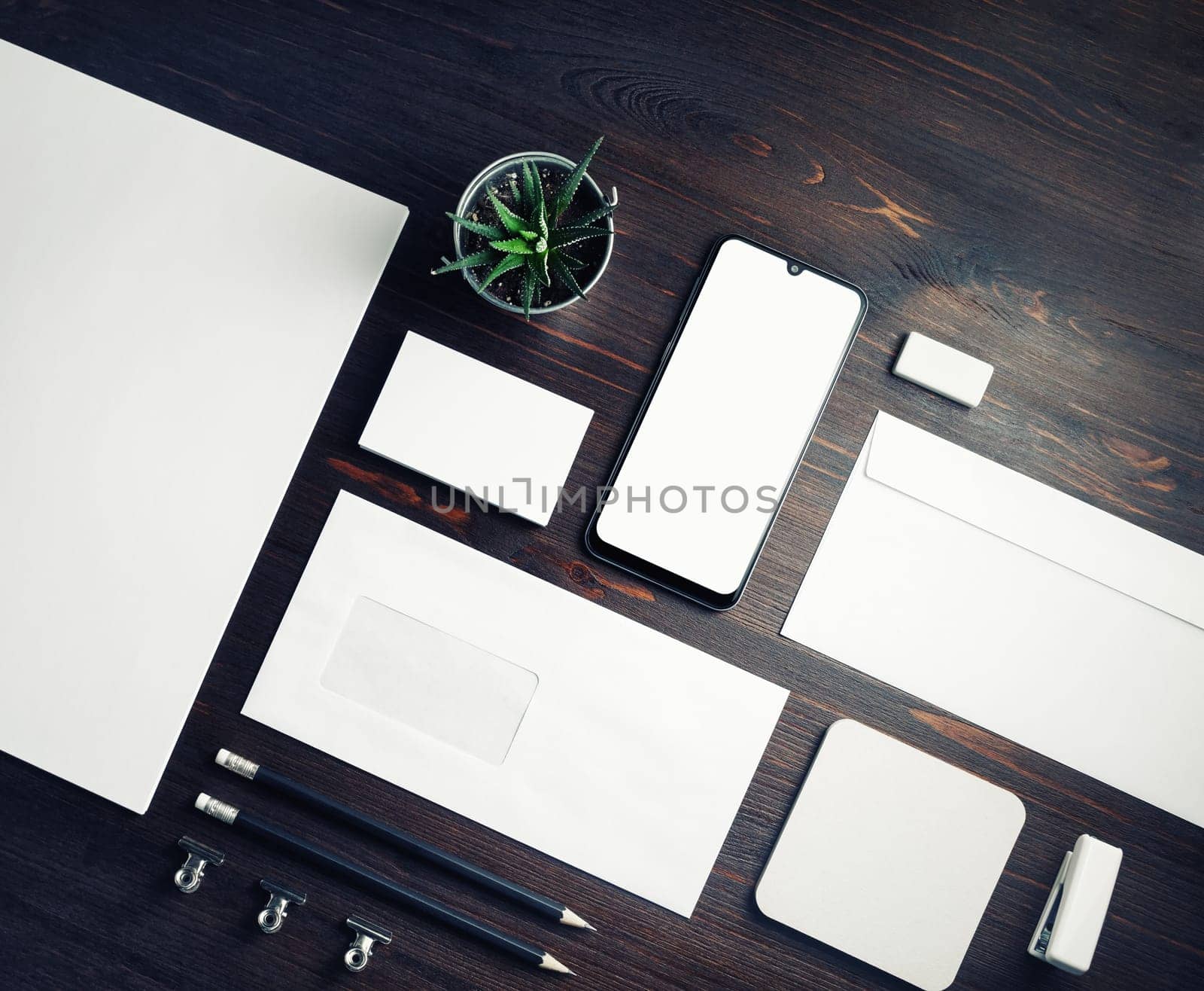 Blank corporate stationery template on wood table background. Responsive design mockup.