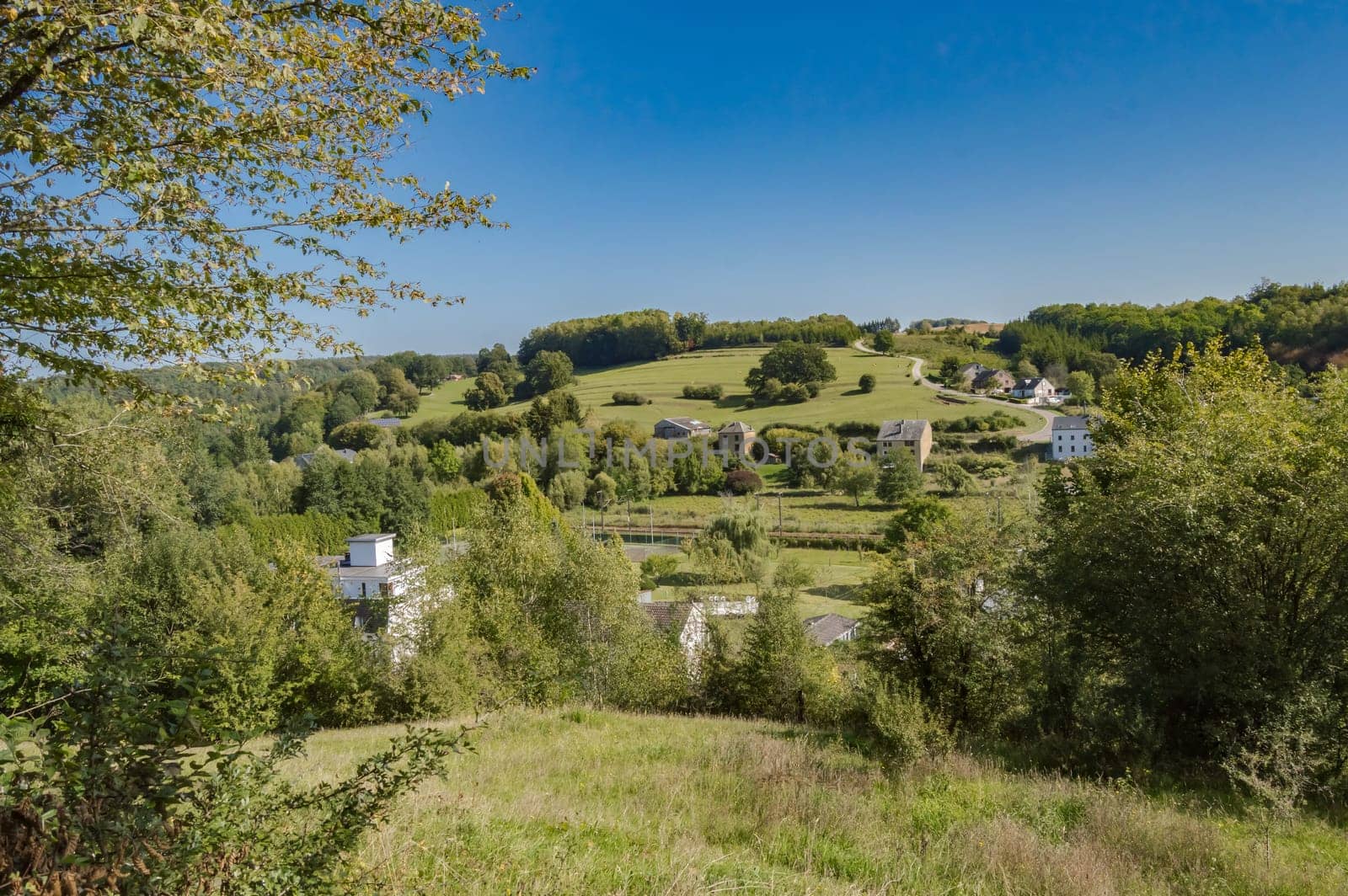 View of a hill in a meadow of the gaume in Meix in front of Virton near Virton in Belgium