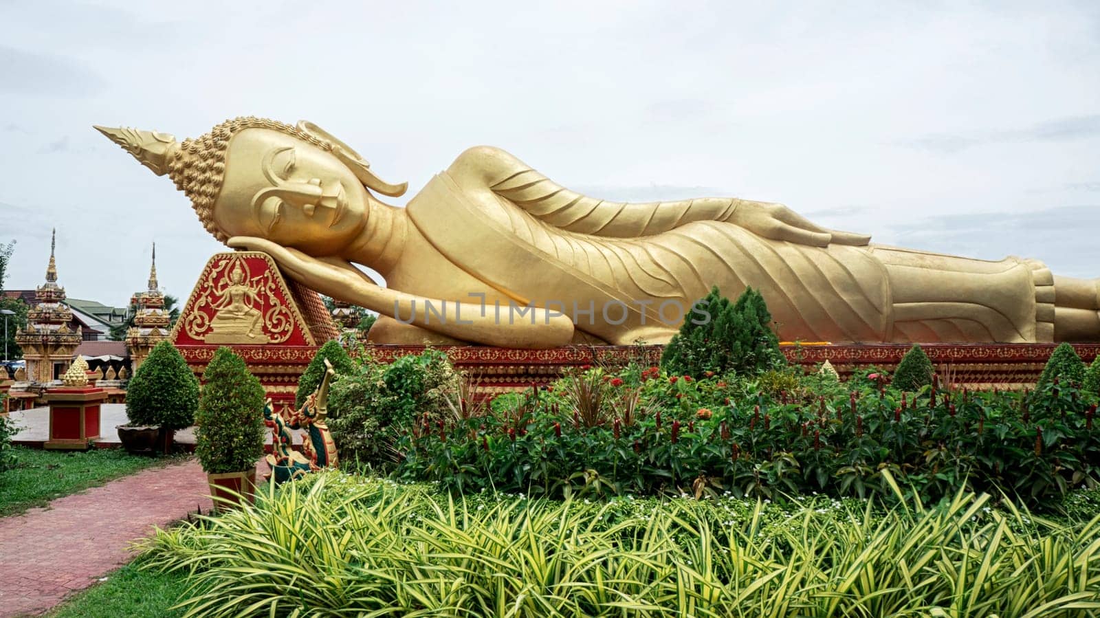 Wat Pha That Luang reclining golden Buddha