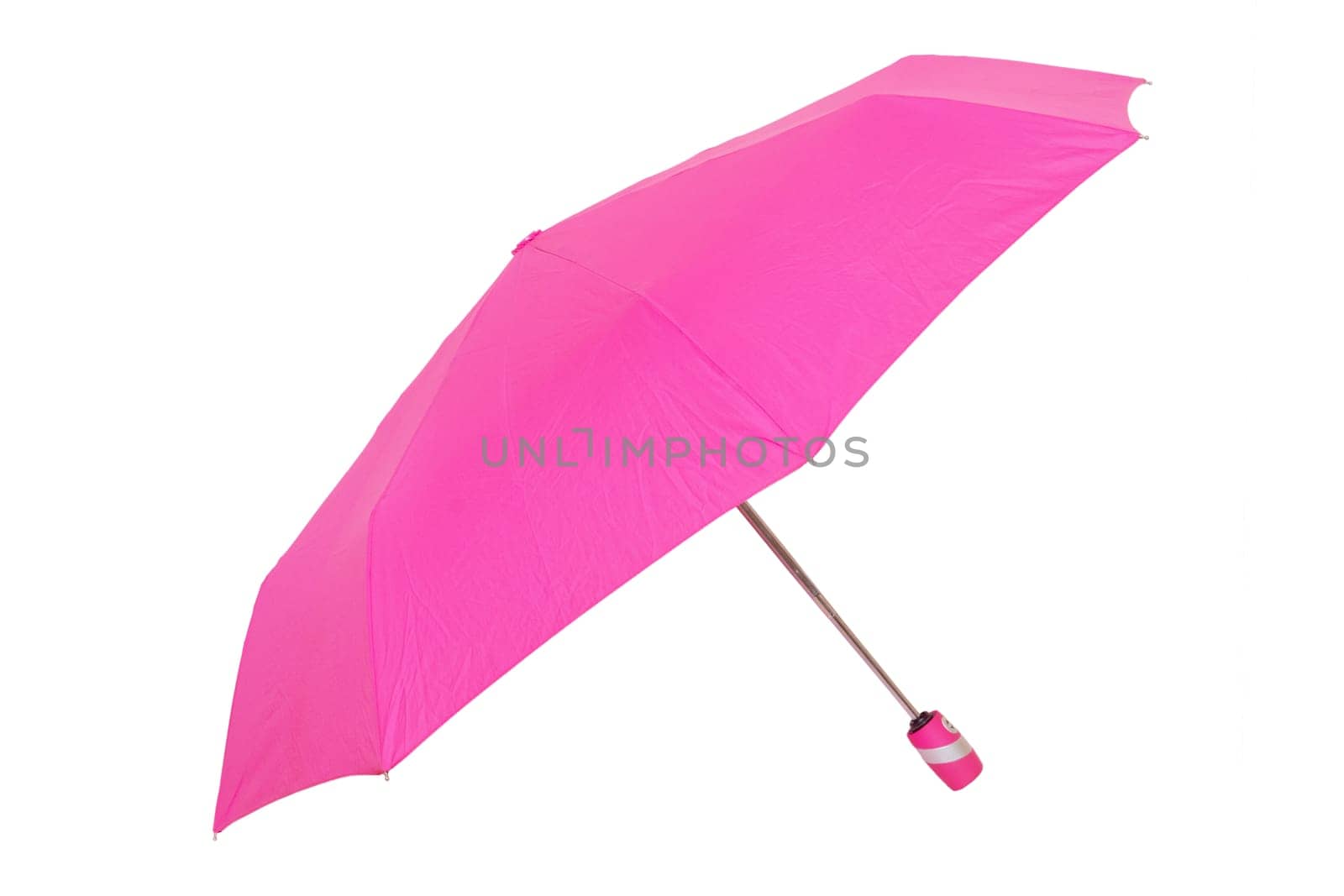 Umbrella isolated. Close-up of beautiful open pink umbrella isolated on a white background. Fashionable female accessories for the rain season.