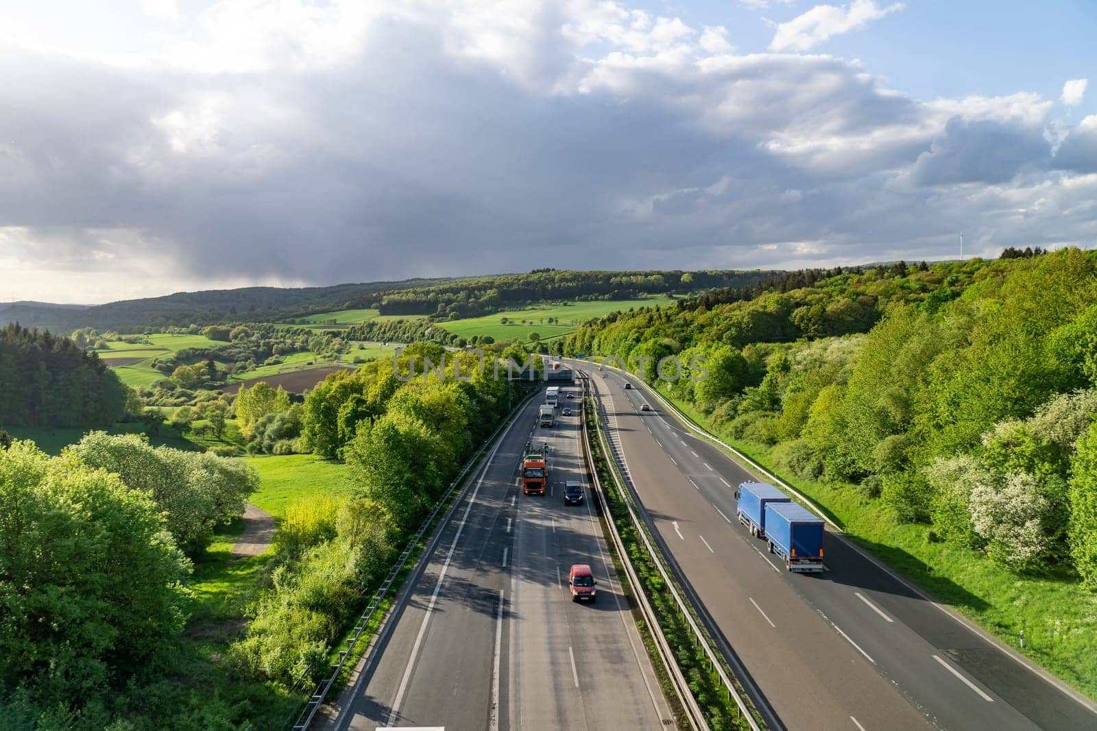 Highway in Germany with cars and sky with big clouds