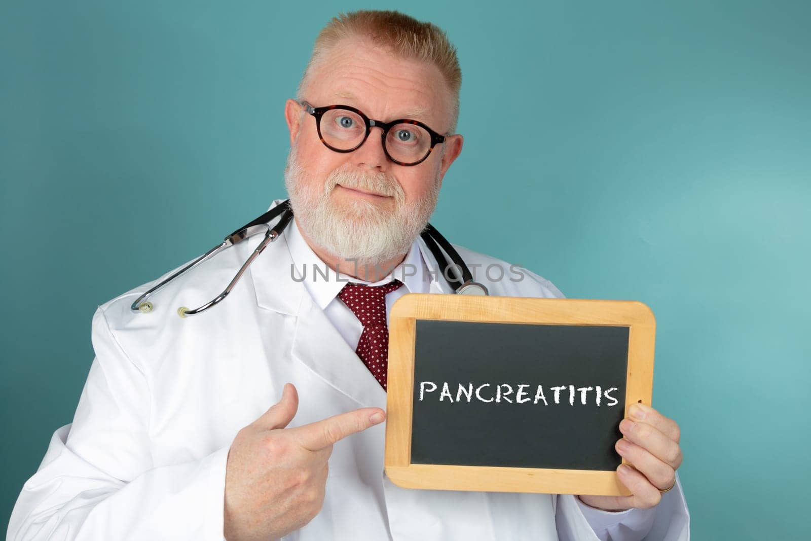 Doctor with eyeglasses holding blank chalkboard on blue background