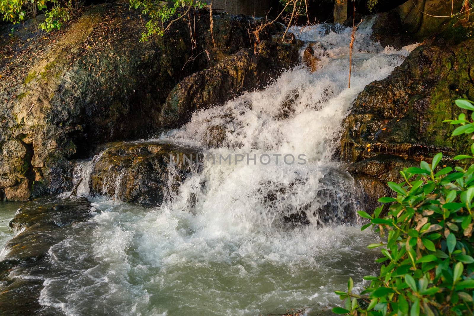 Streams of water from a rocky hill, mountain stream