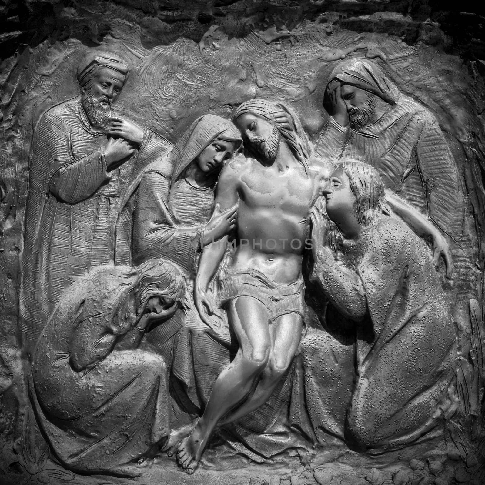Bronze wall engraving scene depicting the Lamentation of Christ