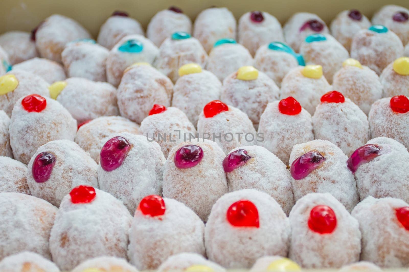 closeup Delicious a lot of donuts with icing
