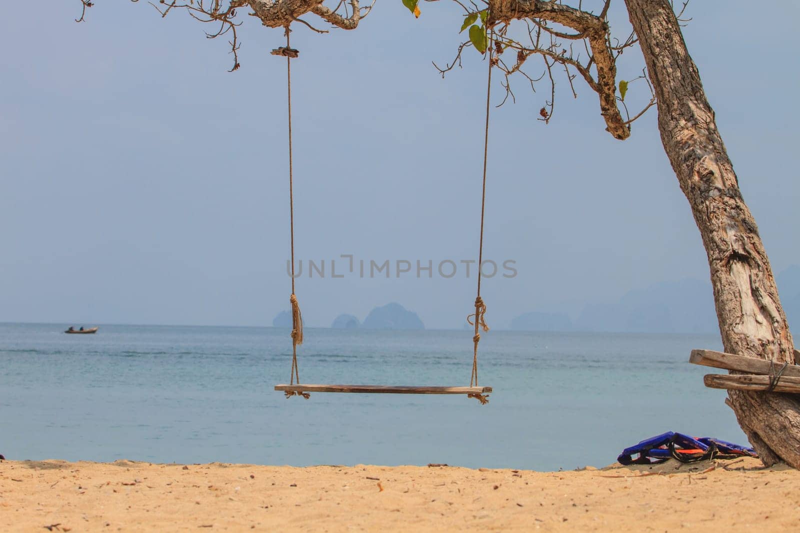 swing on beautiful tropical sea in summer, beach island and the sea in Thailand