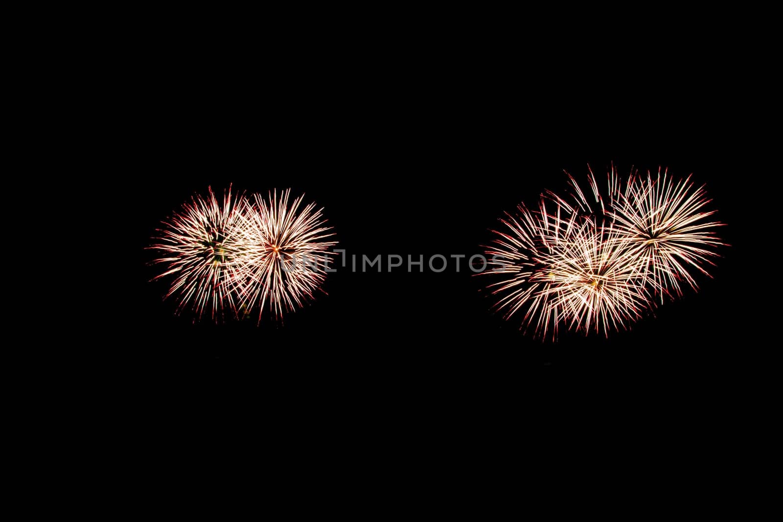 abstract Fireworks light up the dark sky background