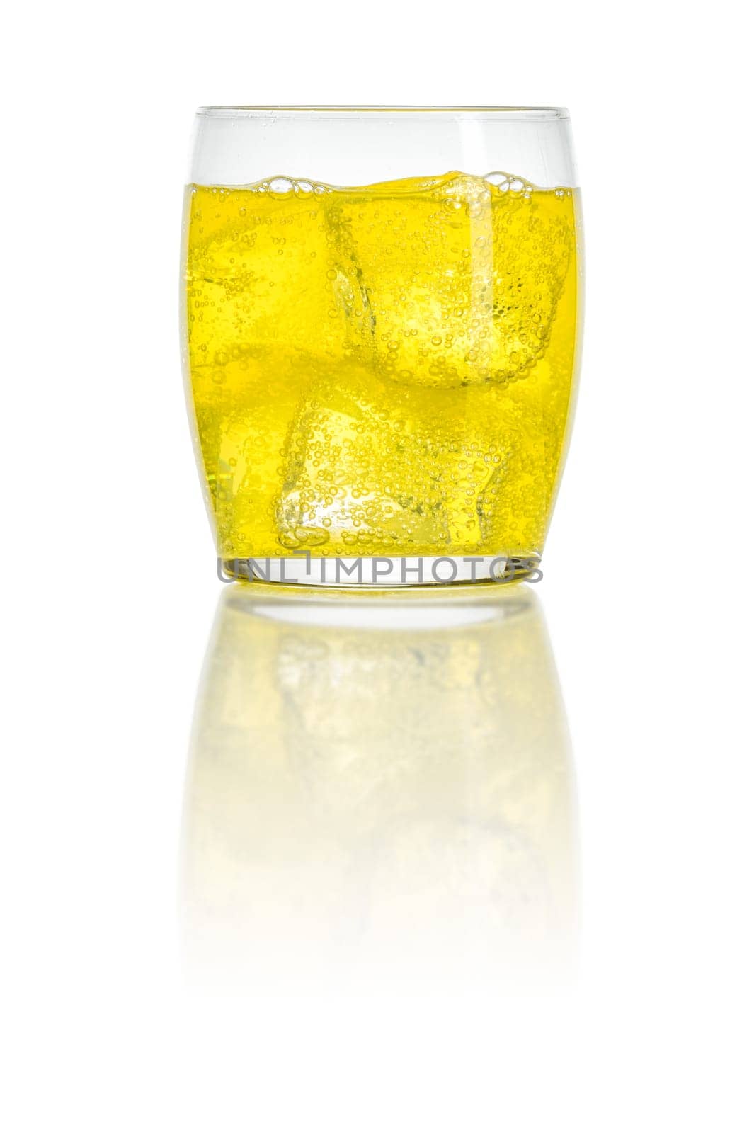 An orange soft drink with ice cubes