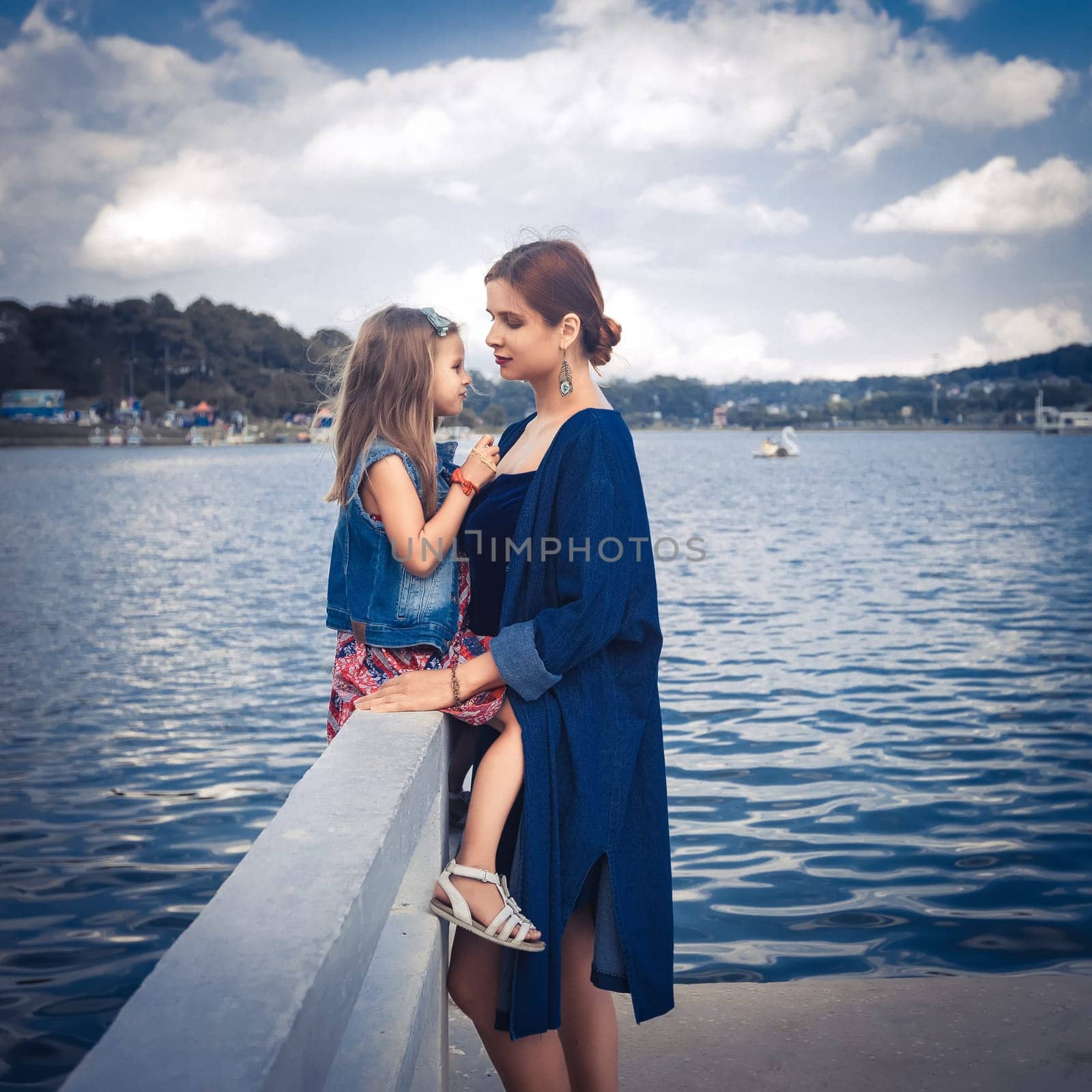 Mother and daughter enjoying at Xuan Huong Lake, Dalat, Vietnam