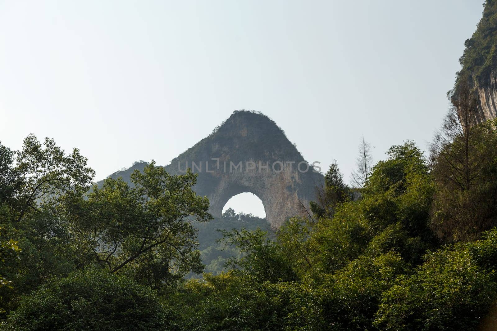 Lunar Mountain Yangshuo, China against the sky and green forest