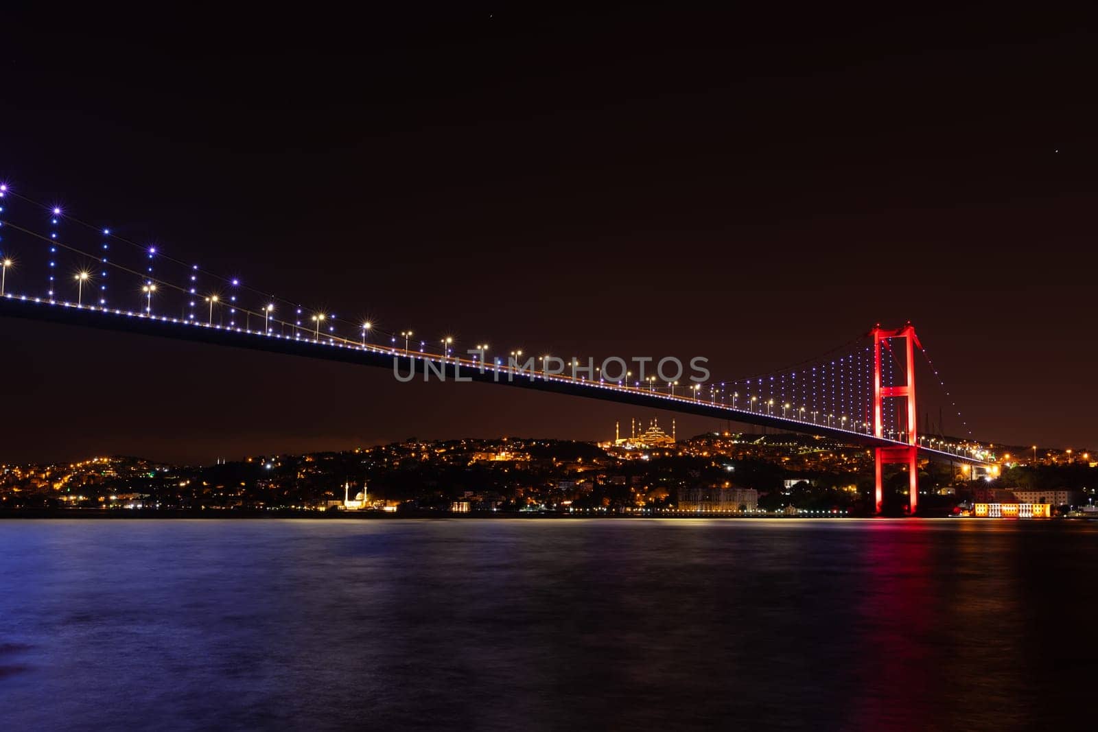The Bosphorus Bridge or the 15 July Martyrs Bridge, view on the Asian side of night Istanbul, Turkey.