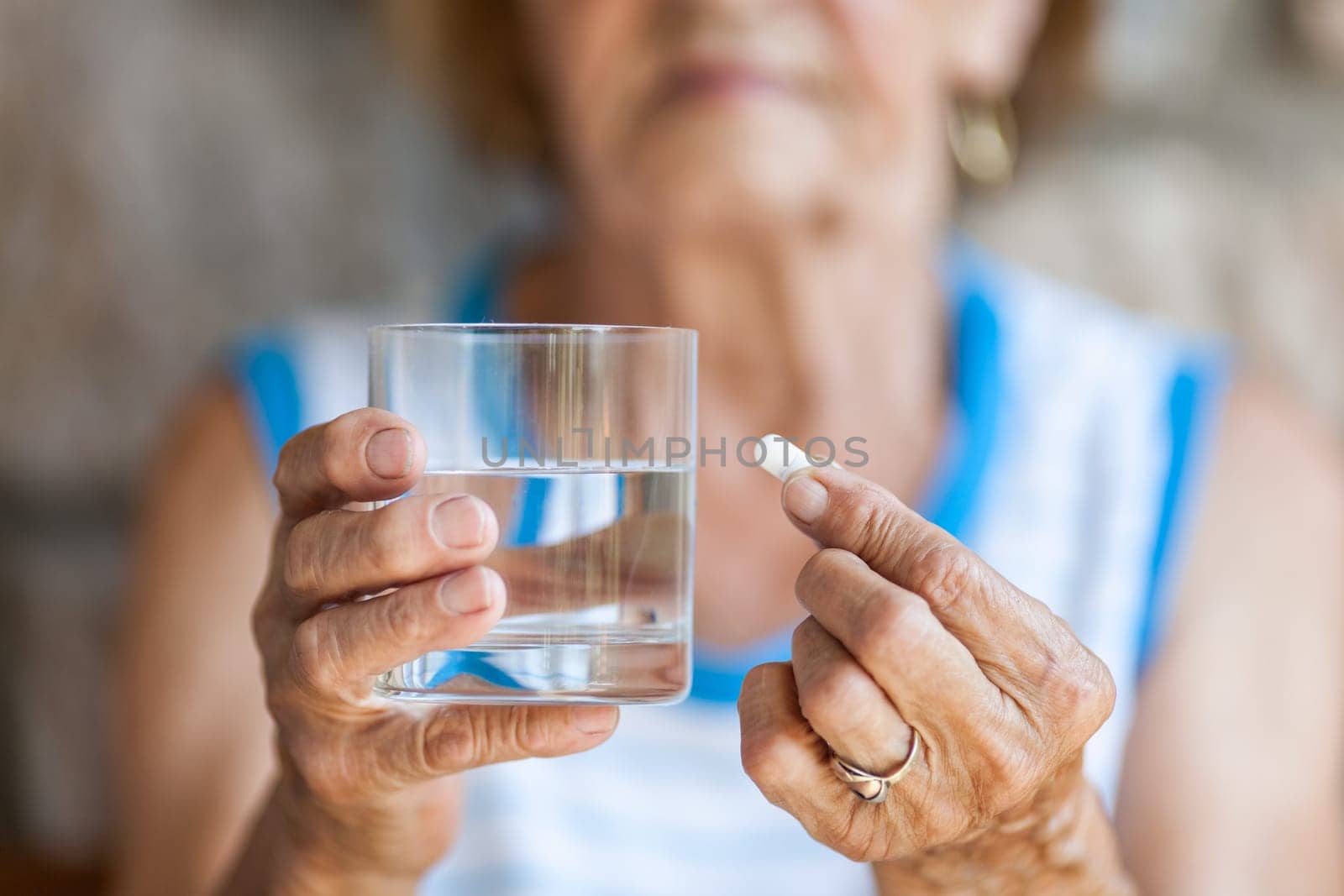 Senior woman taking her daily prescripted medication
