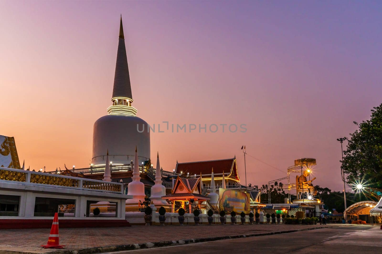 Temple with pagoda and color of sky sunset or sunrise in twilight, Public in Thailand, Nakhon si thammarat province