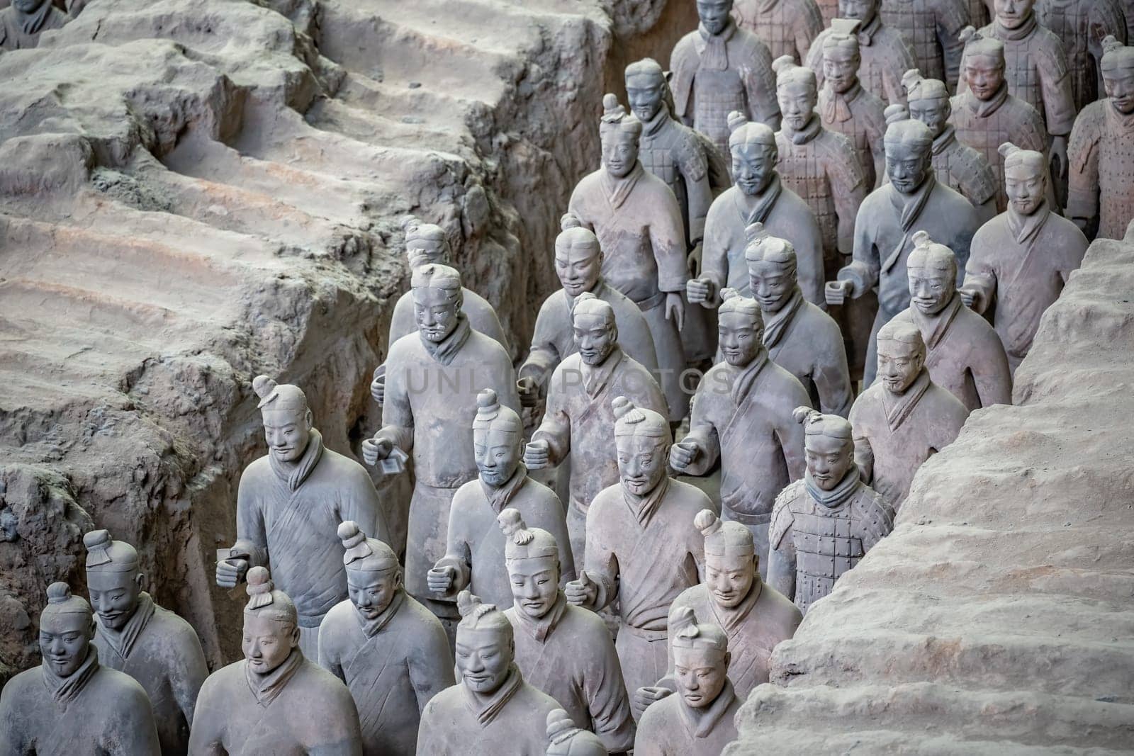 Xian, China -  July 2019 :  Standing clay soldiers forming part of an army of terracota warriors, created during the reign of first chinese emperor Qin Shi Huang Di, Shaanxi Province