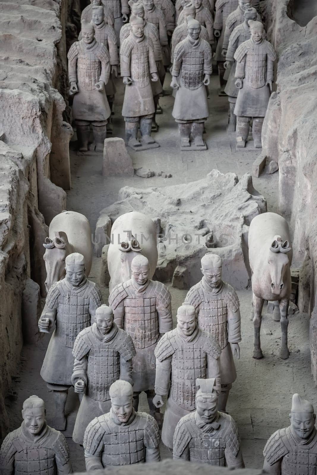 Xian, China -  July 2019 :  Standing clay soldiers forming part of an army of terracota warriors, created during the reign of first chinese emperor Qin Shi Huang Di, Shaanxi Province
