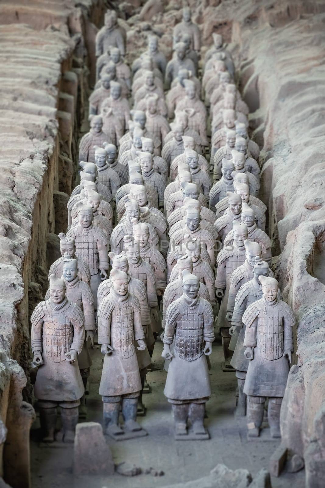 Xian, China -  July 2019 :  Standing clay soldiers forming part of an army of terracota warriors, created during the reign of first chinese emperor Qin Shi Huang Di, Shaanxi Province