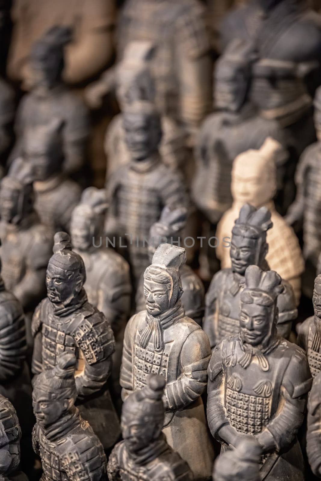Xian, China -  July 2019 :  Souvenir mini small figurines of the clay soldiers of the army of terracota warriors for sale in a gift shop, Shaanxi Province