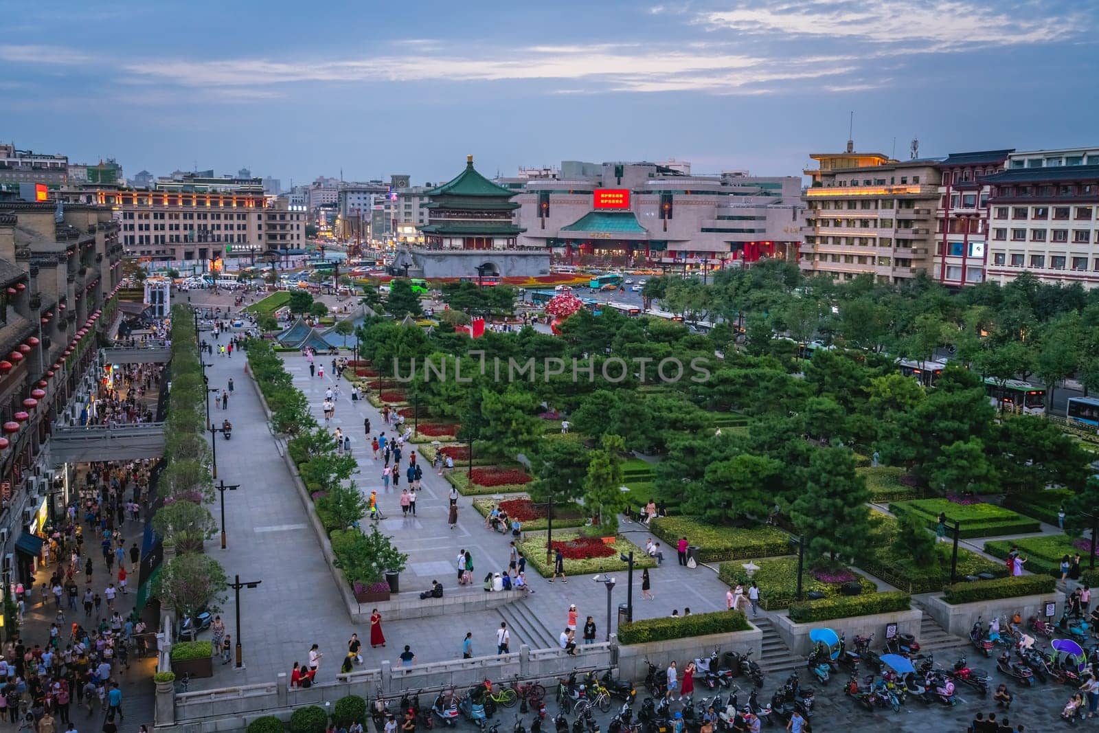 Xian, China -  July 2019 : Crowds walking on streets and town square with landmark Drum Tower in the background, Shaaxi Province