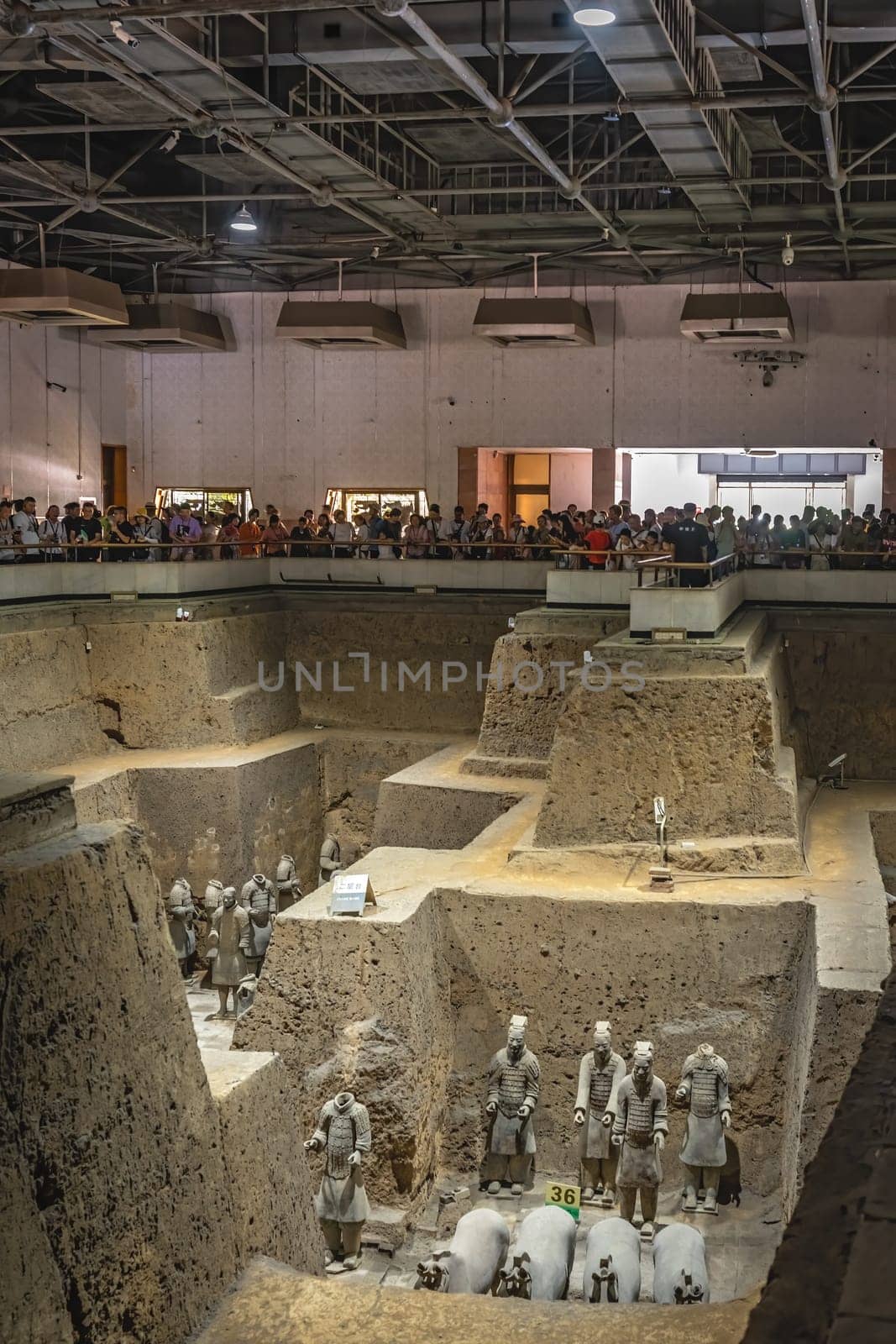 Xian, China -  July 2019 :  Standing clay soldiers forming part of an army of terracota warriors, created during the reign of first chinese emperor Qin Shi Huang Di, Shaanxi Province