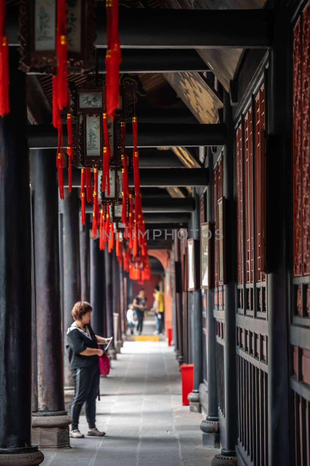 Chengdu, China -  July 2019 : Female chinese tourist sightseeing the popular Wenshu Monastery
